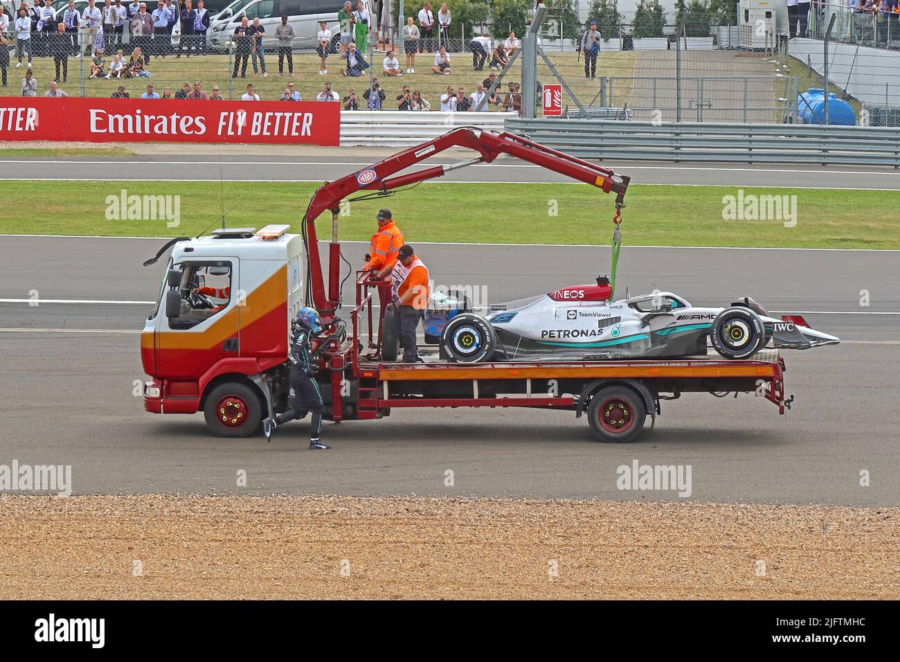 Recovery of Zhou Guanyu's Alfa Romeo British Grand Prix Formula 1 racing car, after crash at Farm Curve, Silverstone Circuit, England,UK,2022 Stock Photo