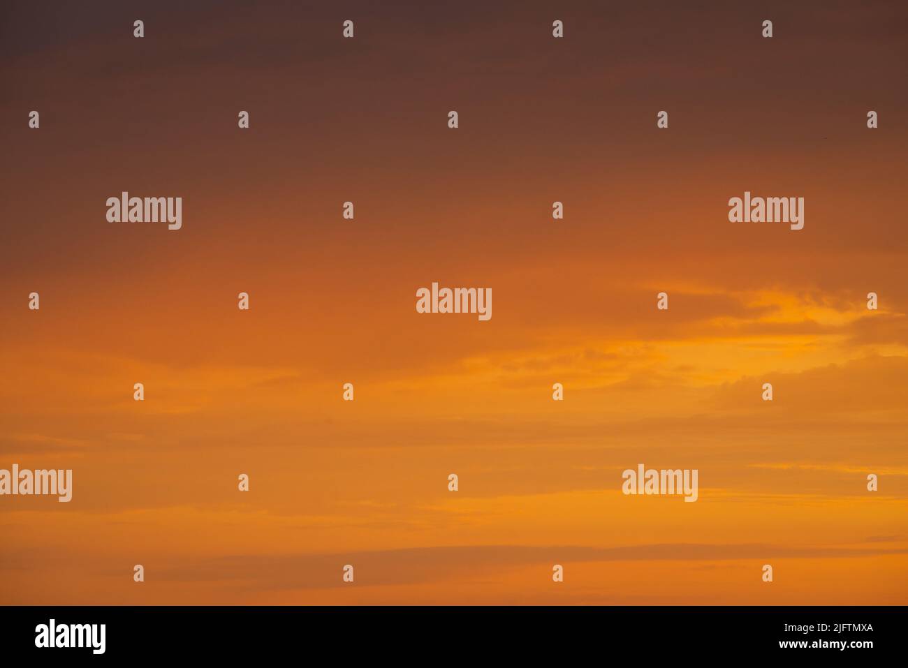 Nature background. Dramatic clouds on the sky in red colors Stock Photo