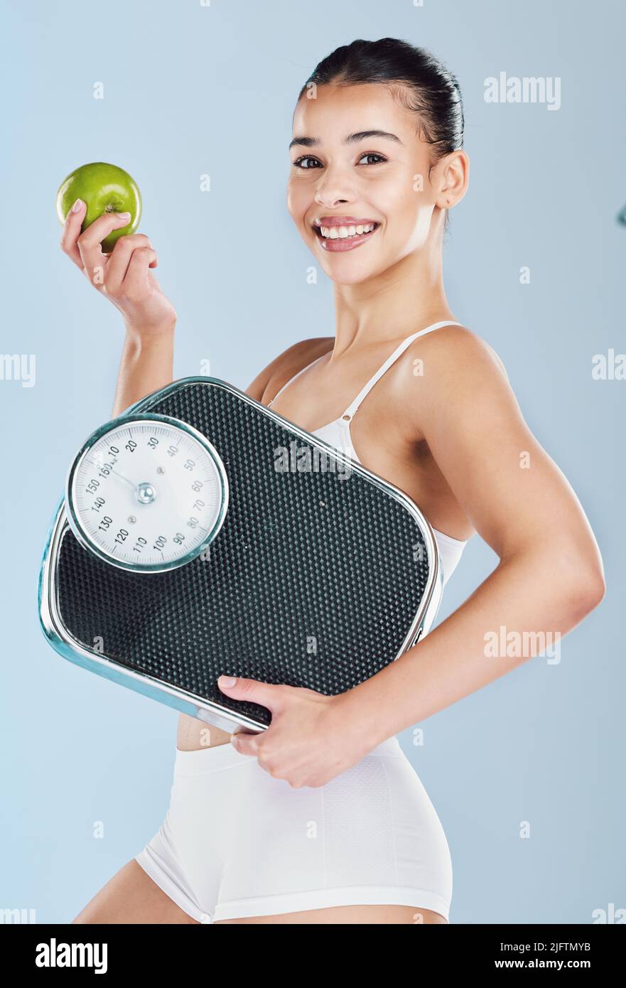 Woman hugging weight scale hi-res stock photography and images - Alamy