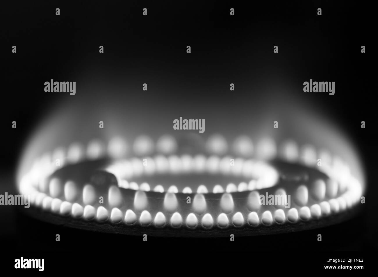 Flames on a domestic gas stove burner in monochrome Stock Photo Alamy