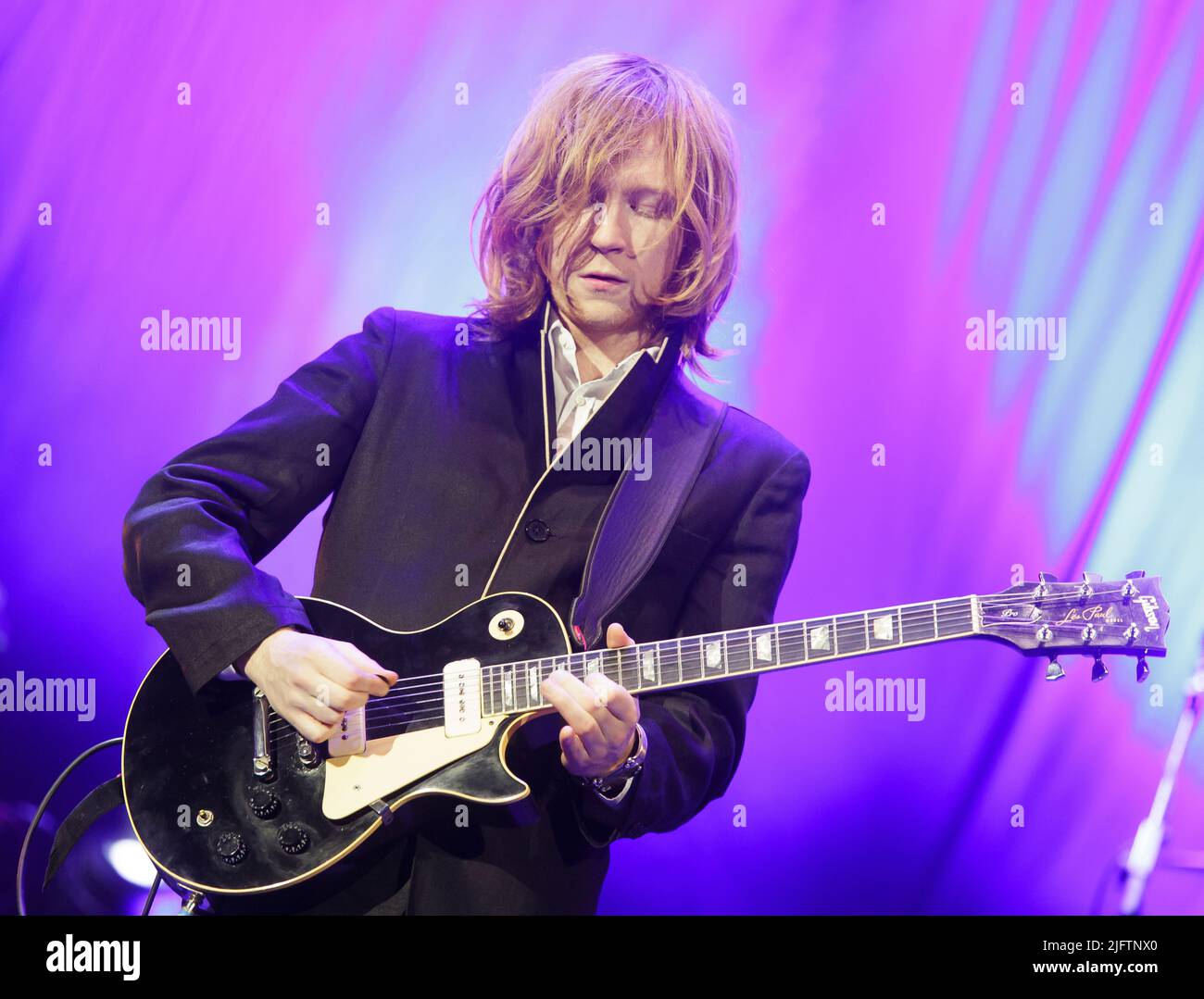 Guitarist Oliver Thompson performs with Bryan Ferry at Colston Hall (now the Bristol Beacon), Bristol in November 2013. Stock Photo