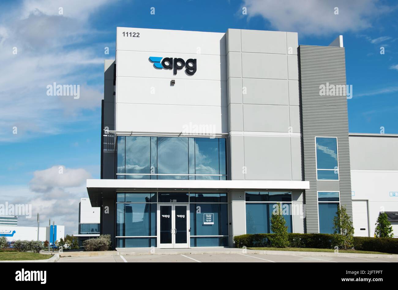 Houston, Texas USA 12-05-2021: APG office building exterior in Houston, TX. Manufacturer and distributor of fluid sealing and conveyance products. Stock Photo