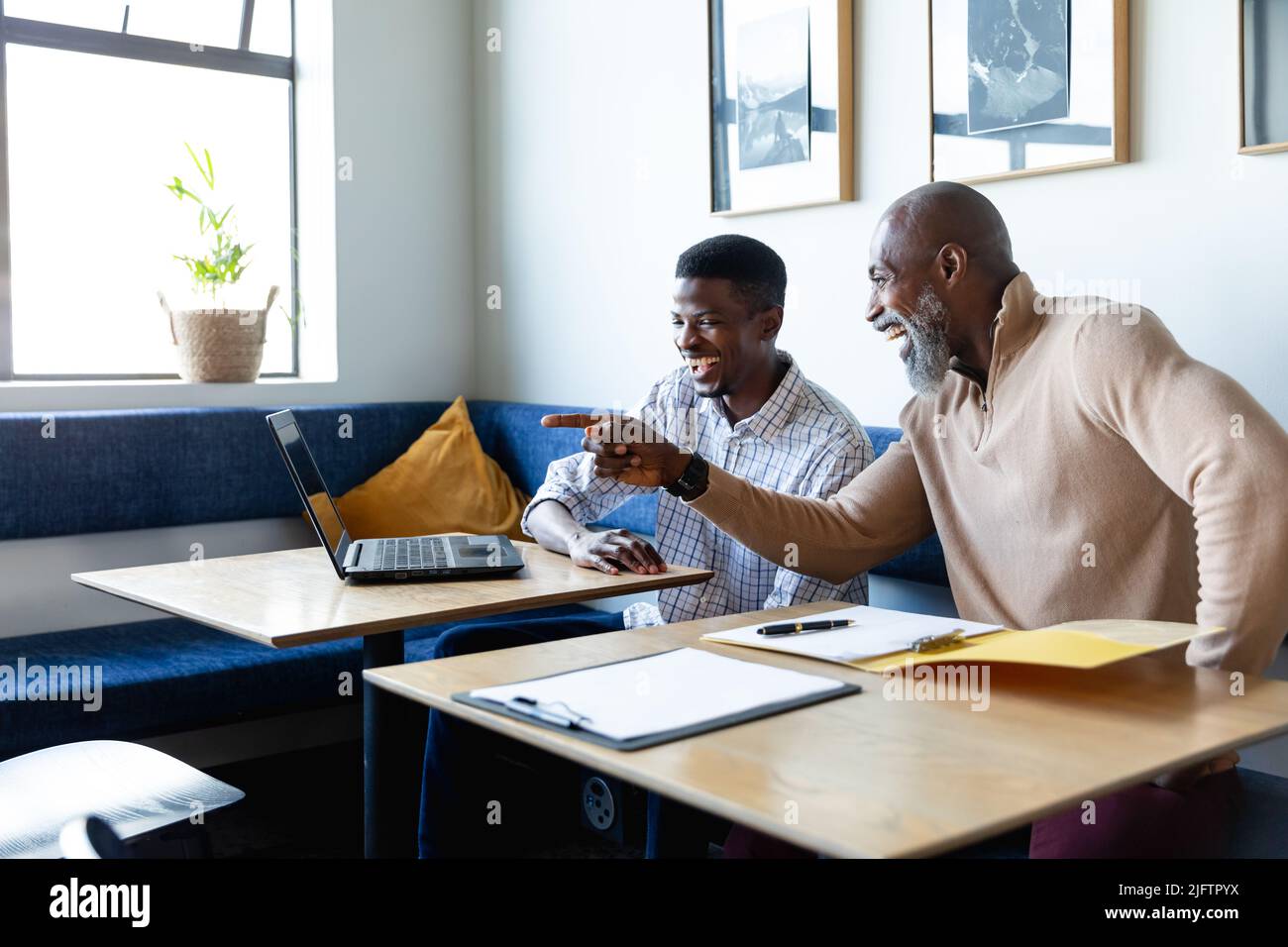 African american business happy laptop hi-res stock photography and ...