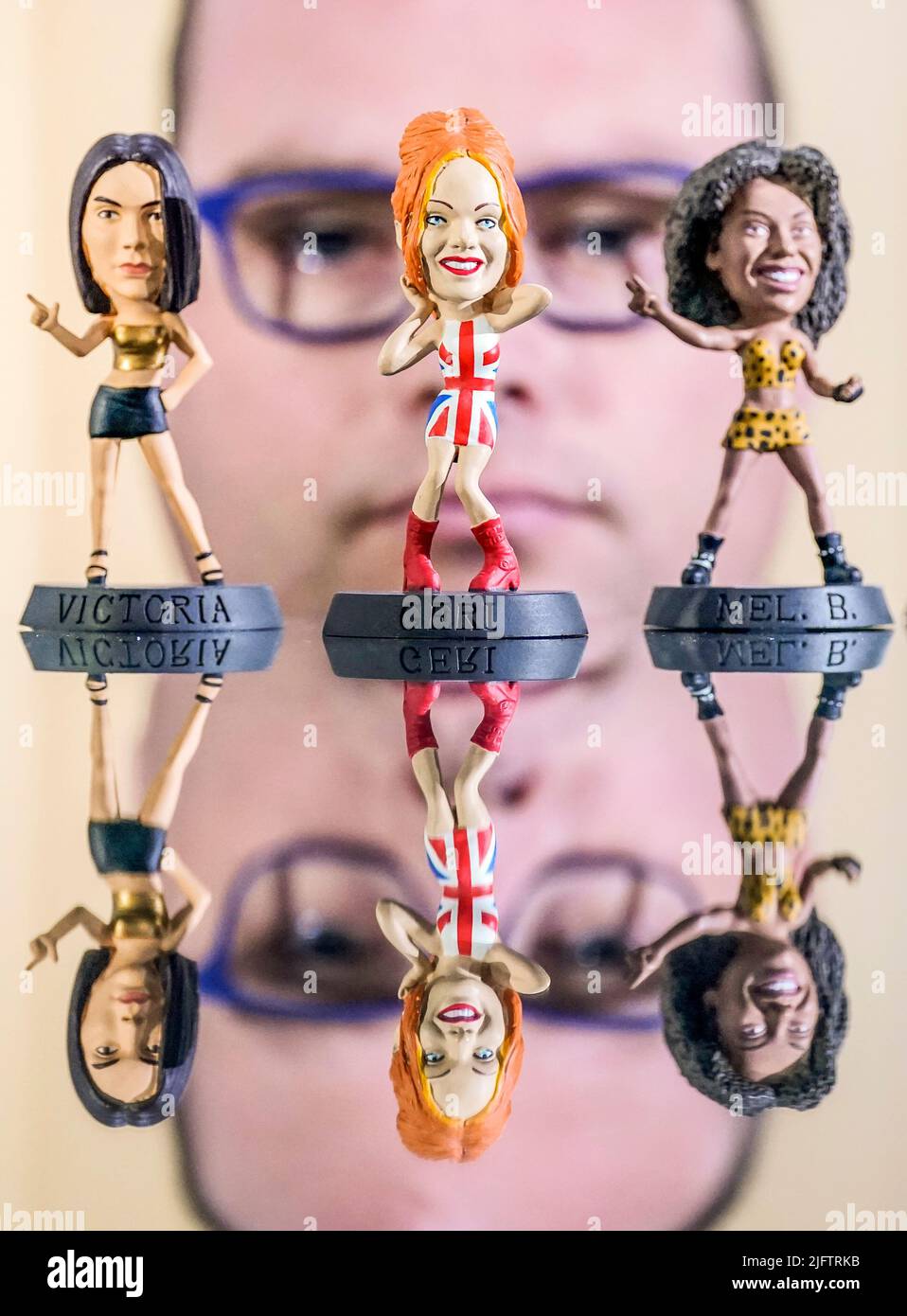 Dr Alex Ombler is pictured with a set of Spice Girls, Girl Power Toys