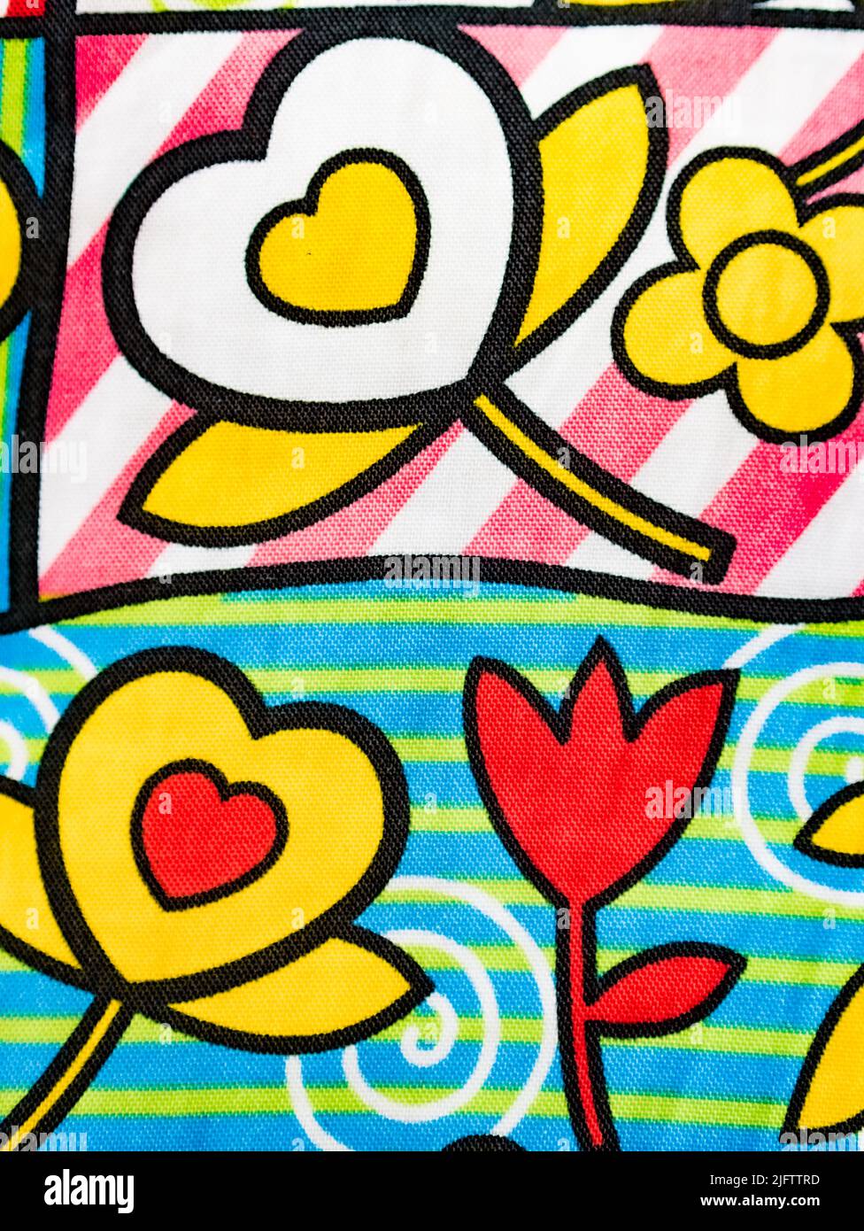 Original fabric background, with drawings of flowers and hearts. Vertical view. Stock Photo
