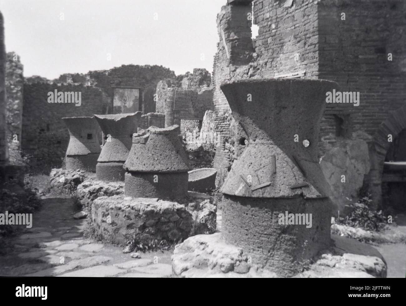 Europe Italy Pompeii ruins vintage photo taken in the late 1940s roman city Remains of a bakery ovens Stock Photo