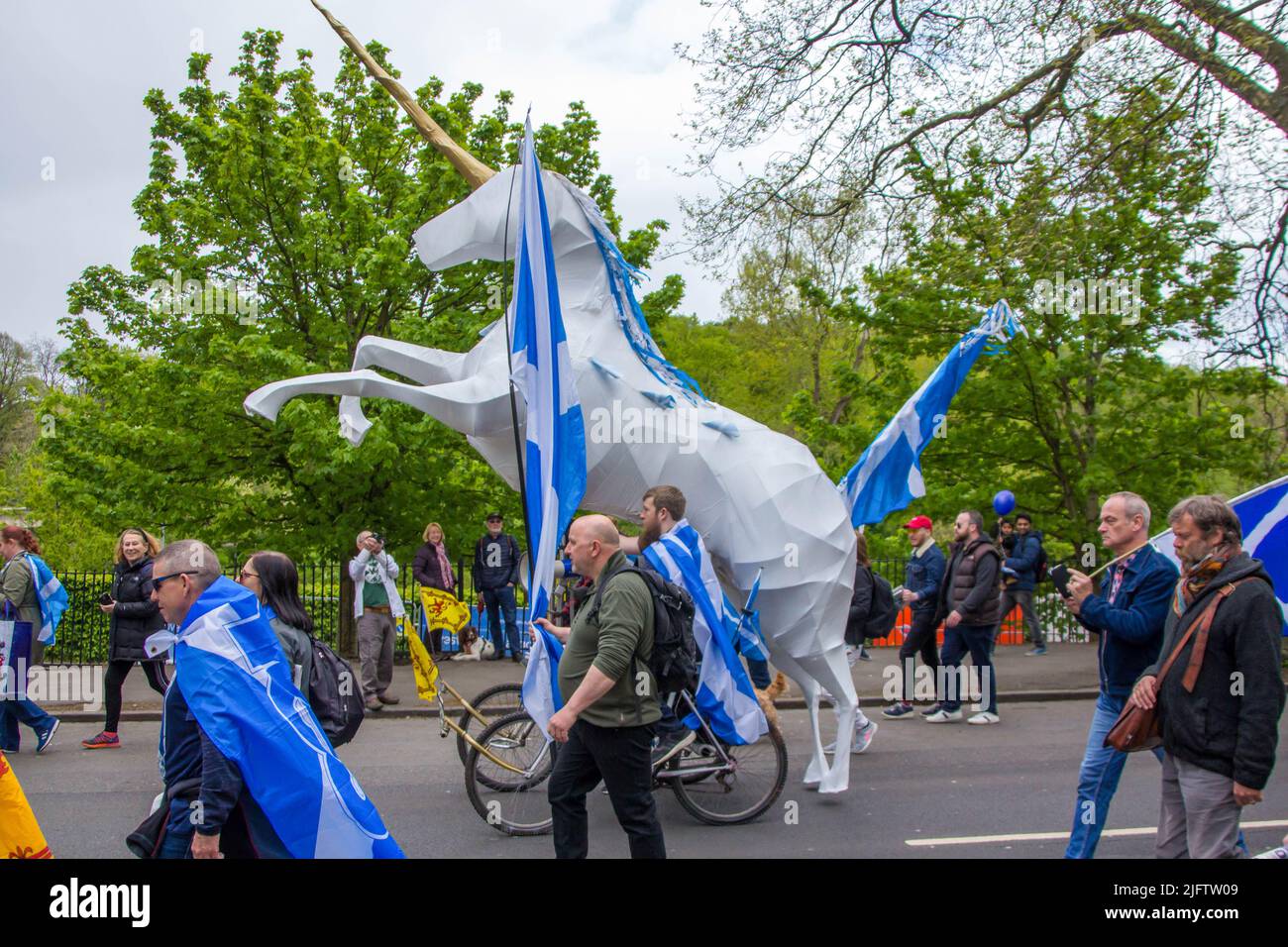 March for Indyref 2 in Glasgow, Statue of Unicorn in Between Marching Crowd Stock Photo