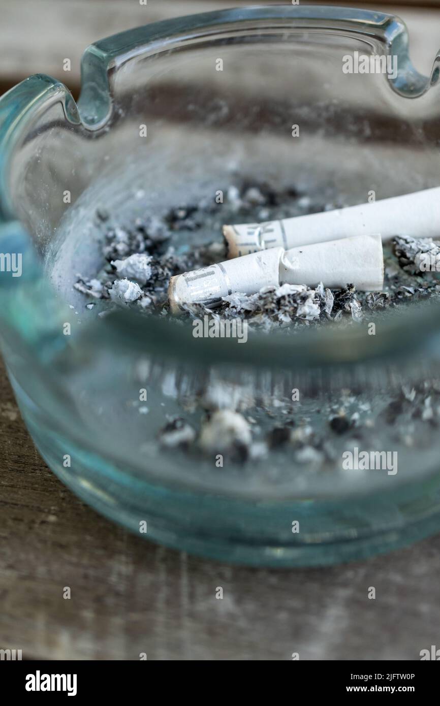 2 cigarettes and an ashtray Two cigarettes in ashtray hi-res stock photography and images
