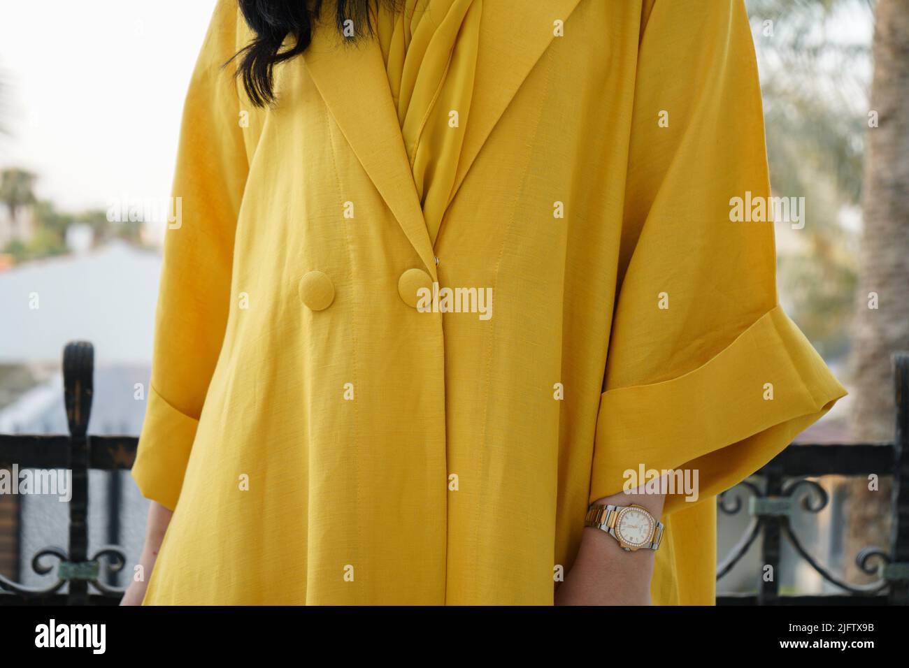 Woman wearing Yellow Abaya, Saudi Abaya Stock Photo