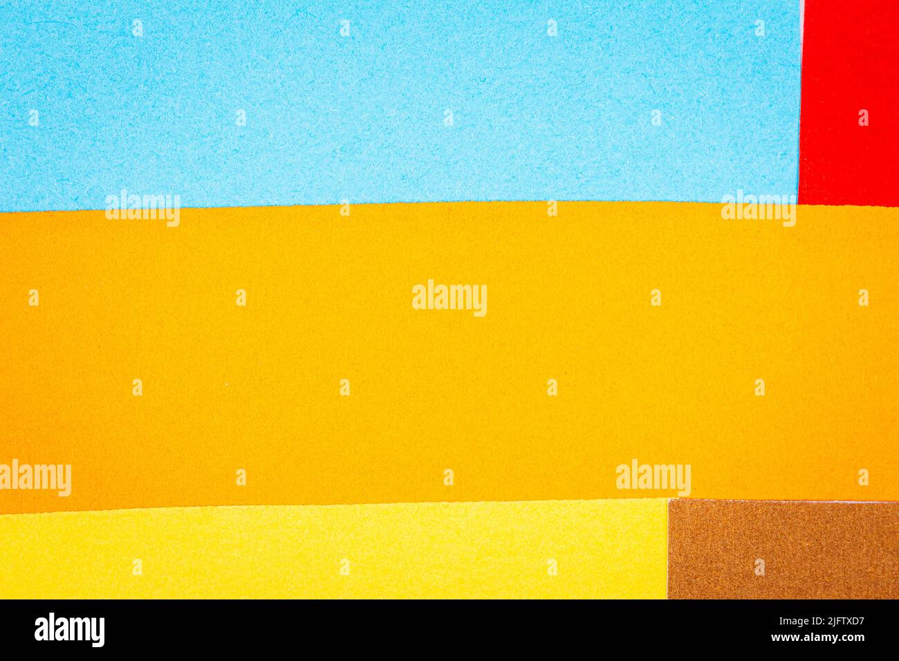 Multicolor background from a paper of different colors. Abstract ...