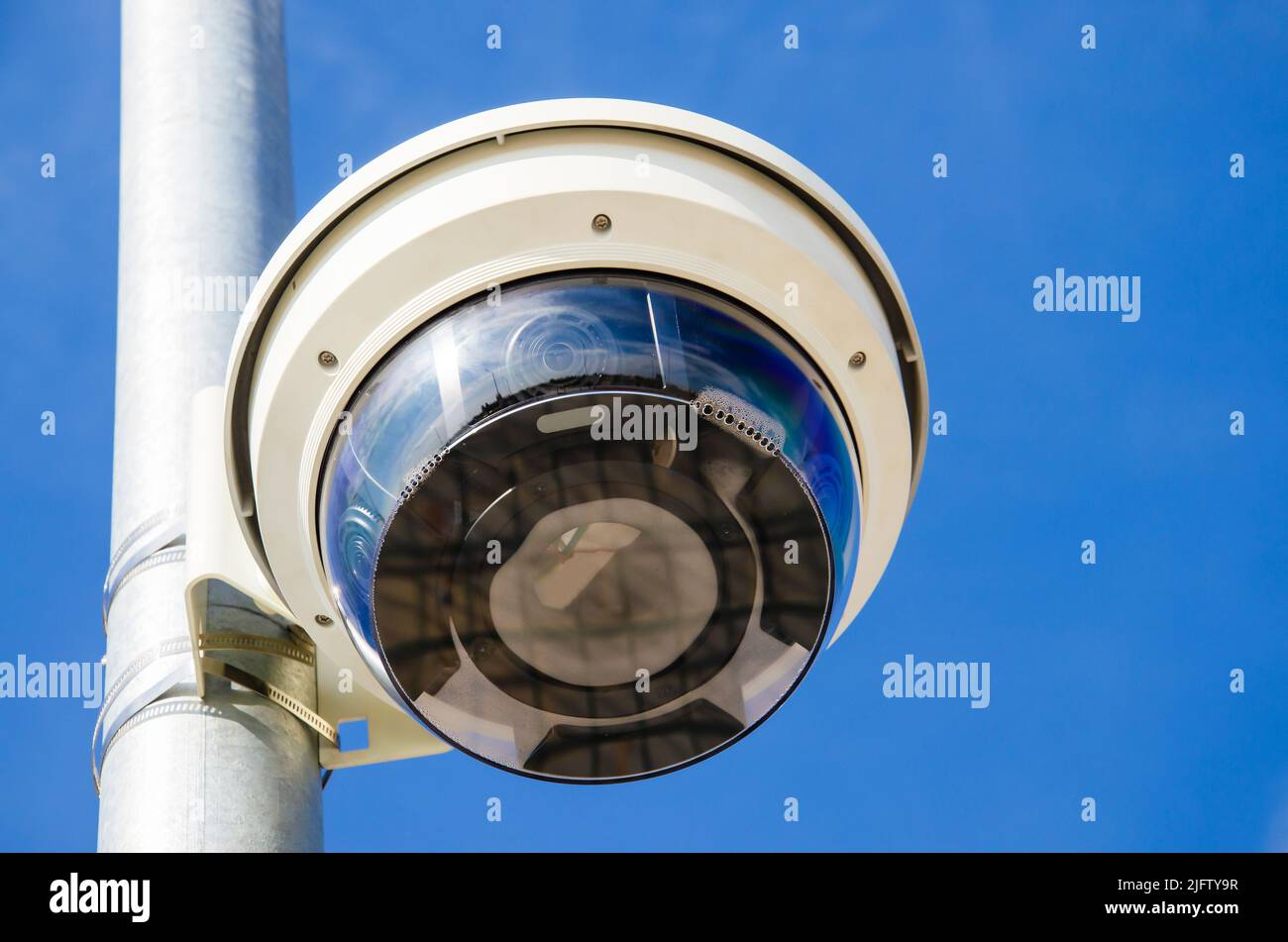 A recording device on the street. Video camera in the sky background