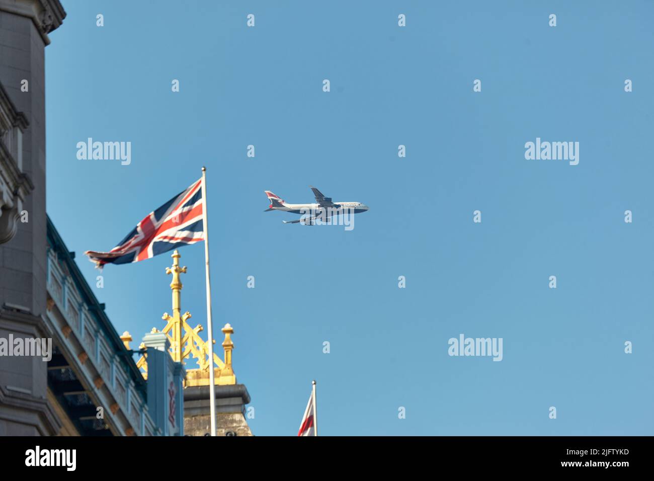 British Airways plane flying over Tower Bridge, London, UK. Stock Photo