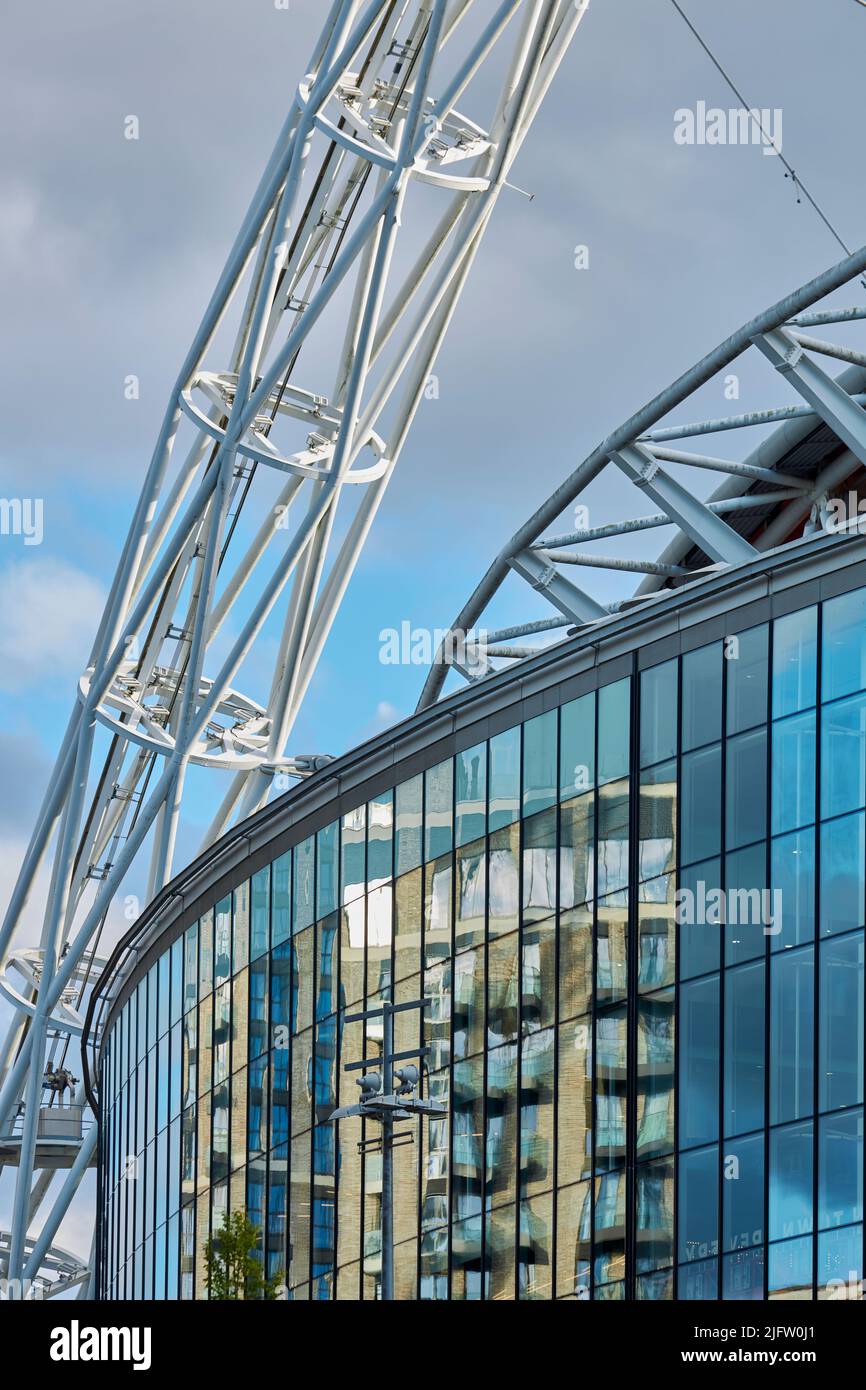 The Steel arch of Wembley stadium known as the 'Wembley arch' supports the roof structure is 134 meter (440 ft) high with a span of 317 metres. Stock Photo