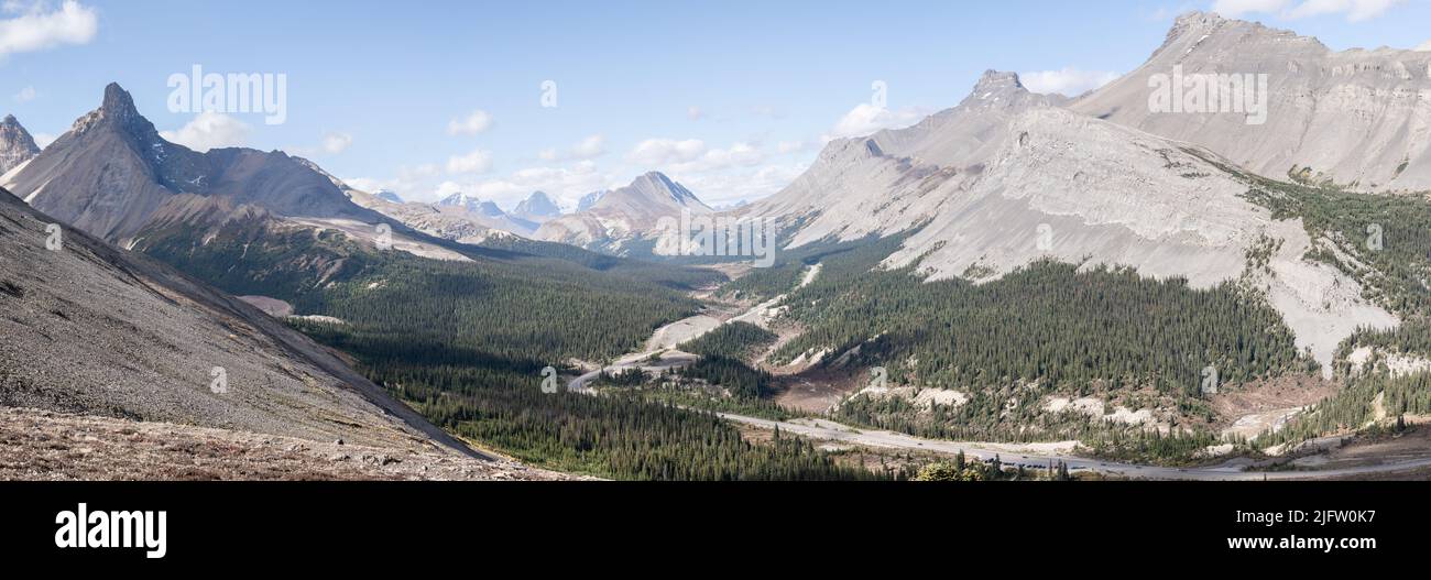 Panoramic view on beautiful alpine valley with highway leading through it, Jasper, Canada Stock Photo