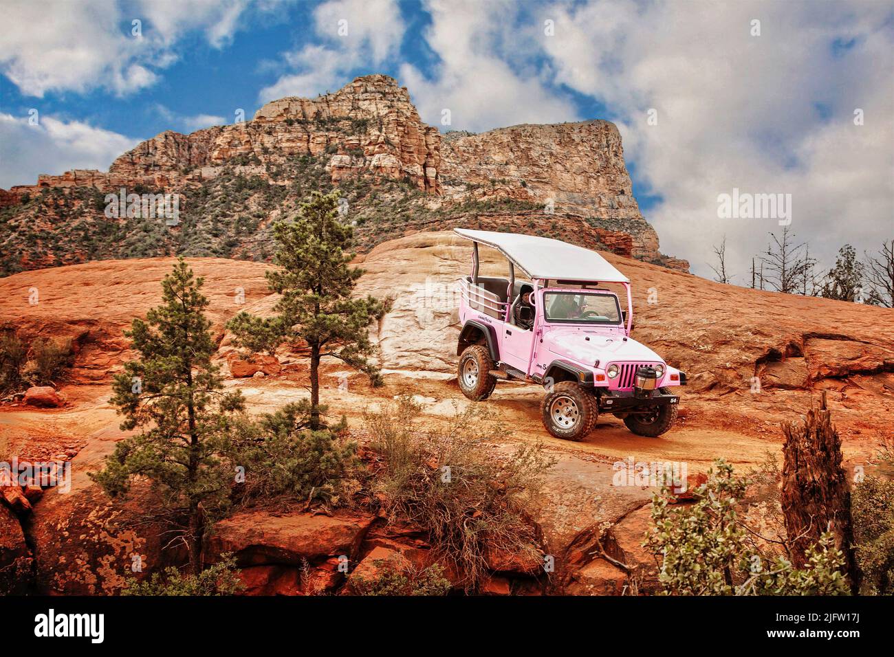 A Jeep tour explores the red rock in the backcountry around Sedona, Arizona. Stock Photo