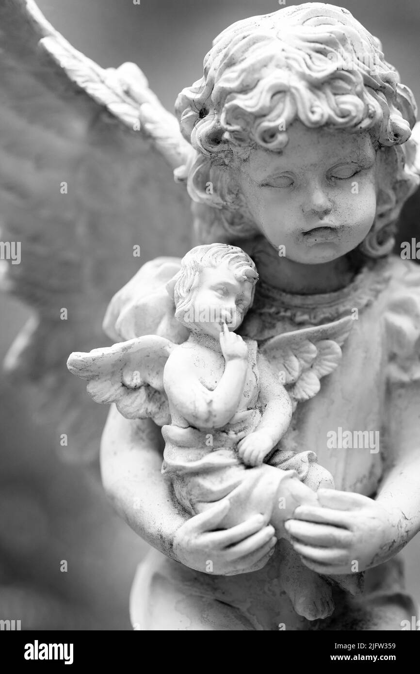 Sculpture of Cherub Angel with wings representing love faith and