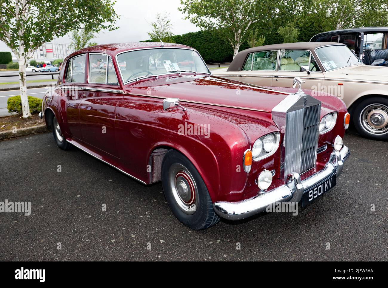 Three-quarters front view of a Red, 1963, Rolls-Royce Silver Cloud MkIII, on display at the 2021 Silverstone Classic Stock Photo