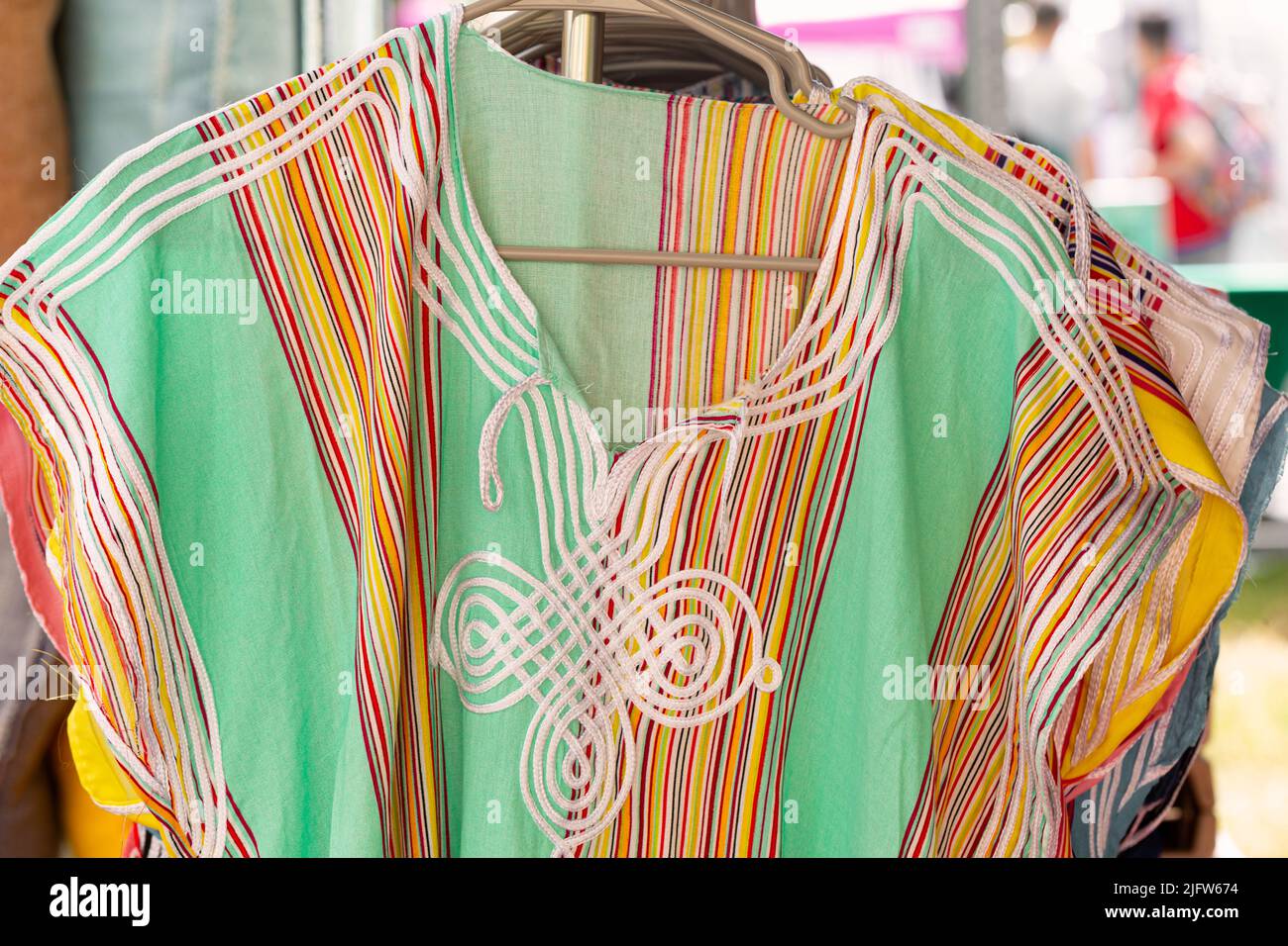 Beautiful handmade Moroccan tunic dresses at an outdoor market Stock Photo