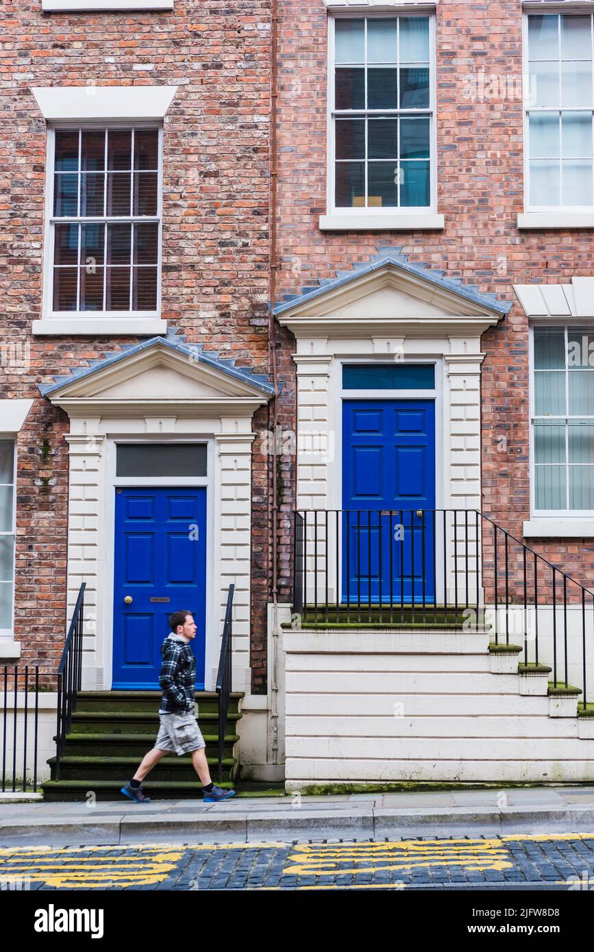 Two blue wooden front doors at the entrance of townhouses. Liverpool