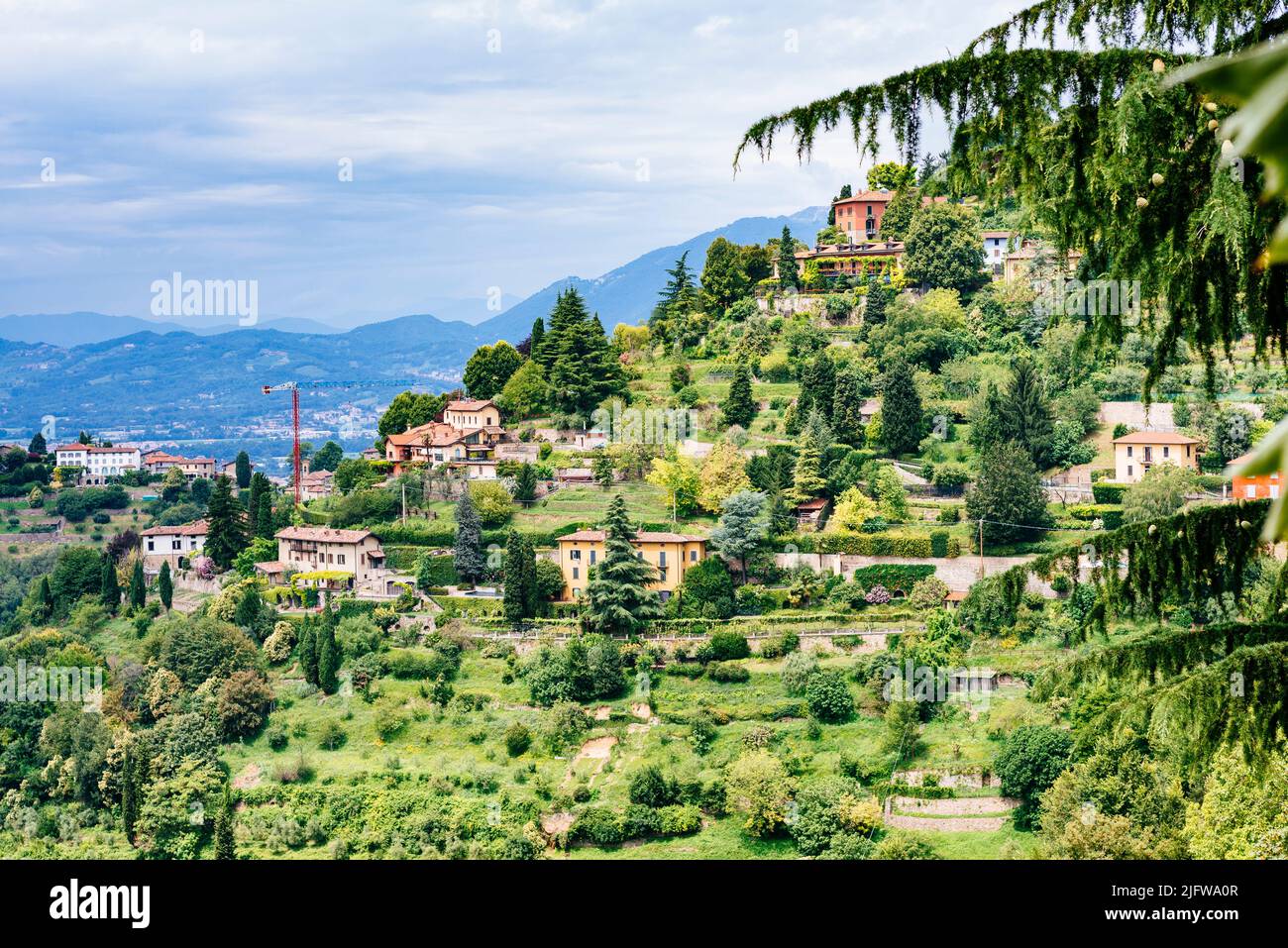 Stately homes on the hill of San Vigilio, at the top of which is the castle of San Vigilio that protected the city since medieval times. Bergamo, Lomb Stock Photo