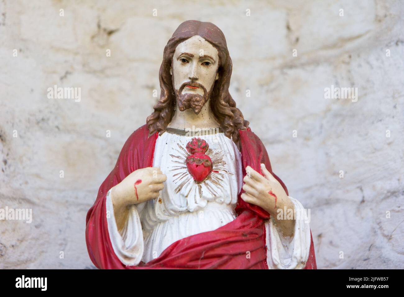 The statue of the Most sacred heart of Jesus in a private garden in Valenciennes, France. Stock Photo