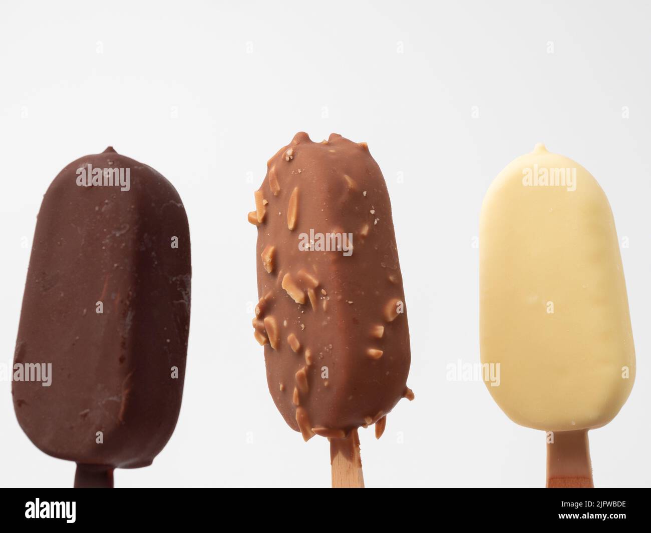 Three types of ice cream on a stick. Ice cream on a white background