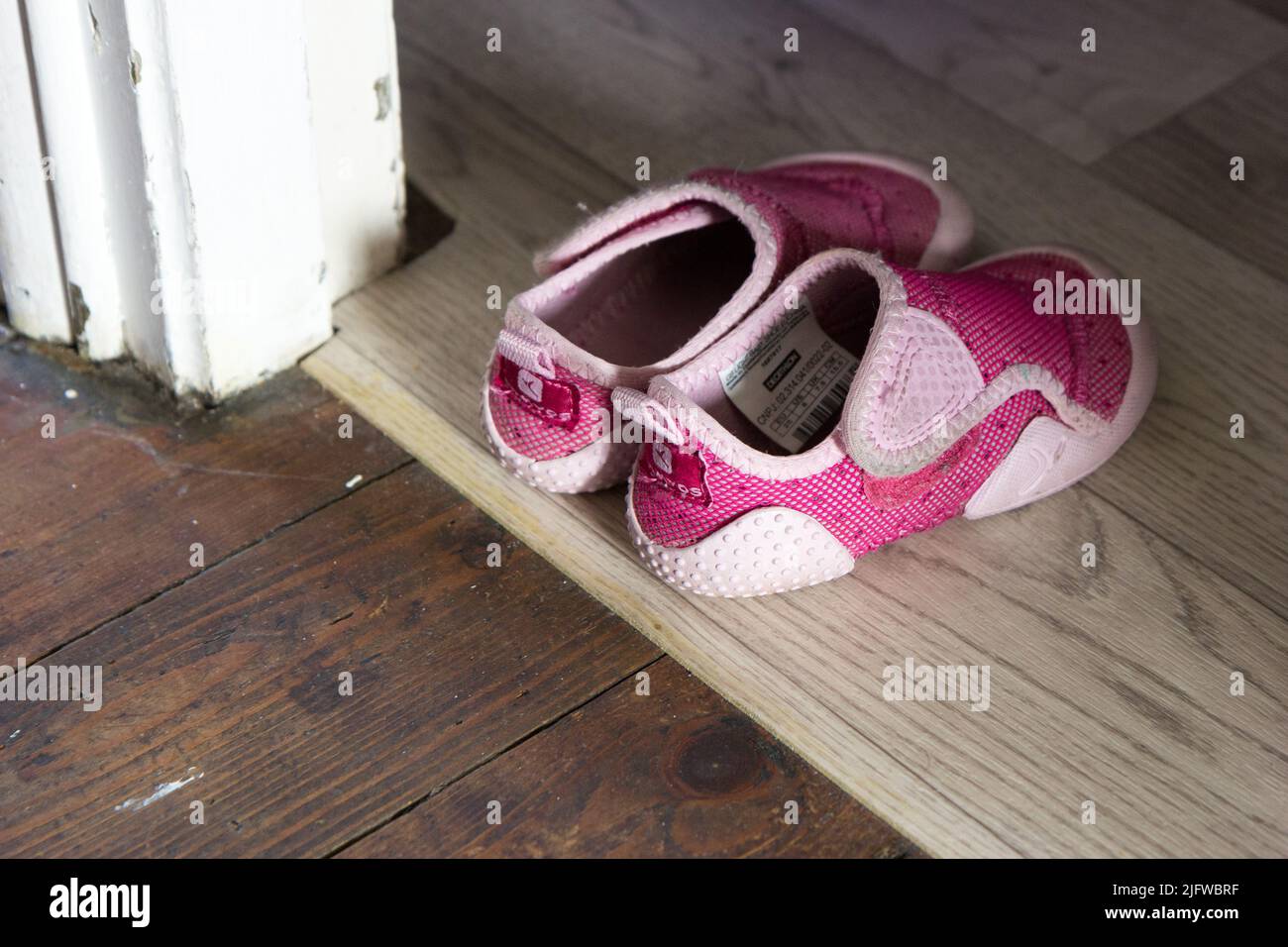 Valenciennes, France 2017/02/06. Empty Domyos shoes of a little 3-year-old child put on a doorstep Stock Photo