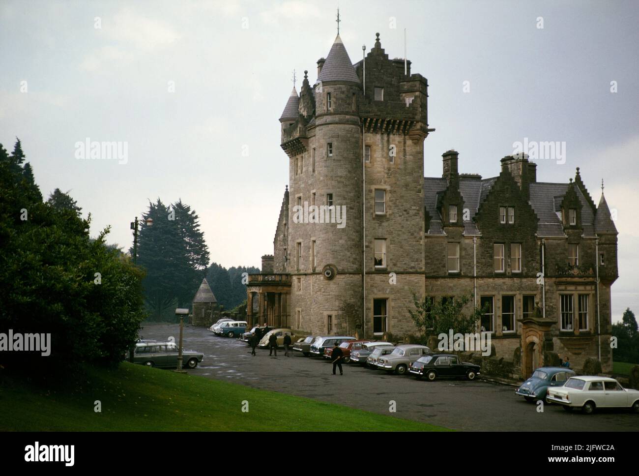 Cars parked at Belfast Castle completed 1870, historic Victorian building, Belfast, Northern Ireland, UK 1960s Stock Photo
