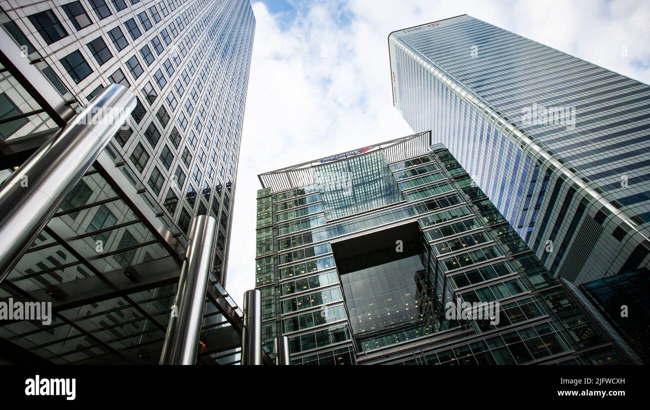 City Banks, London. Low, wide angle view of the business skyscrapers of London's Docklands with global bank logos visible. Stock Photo