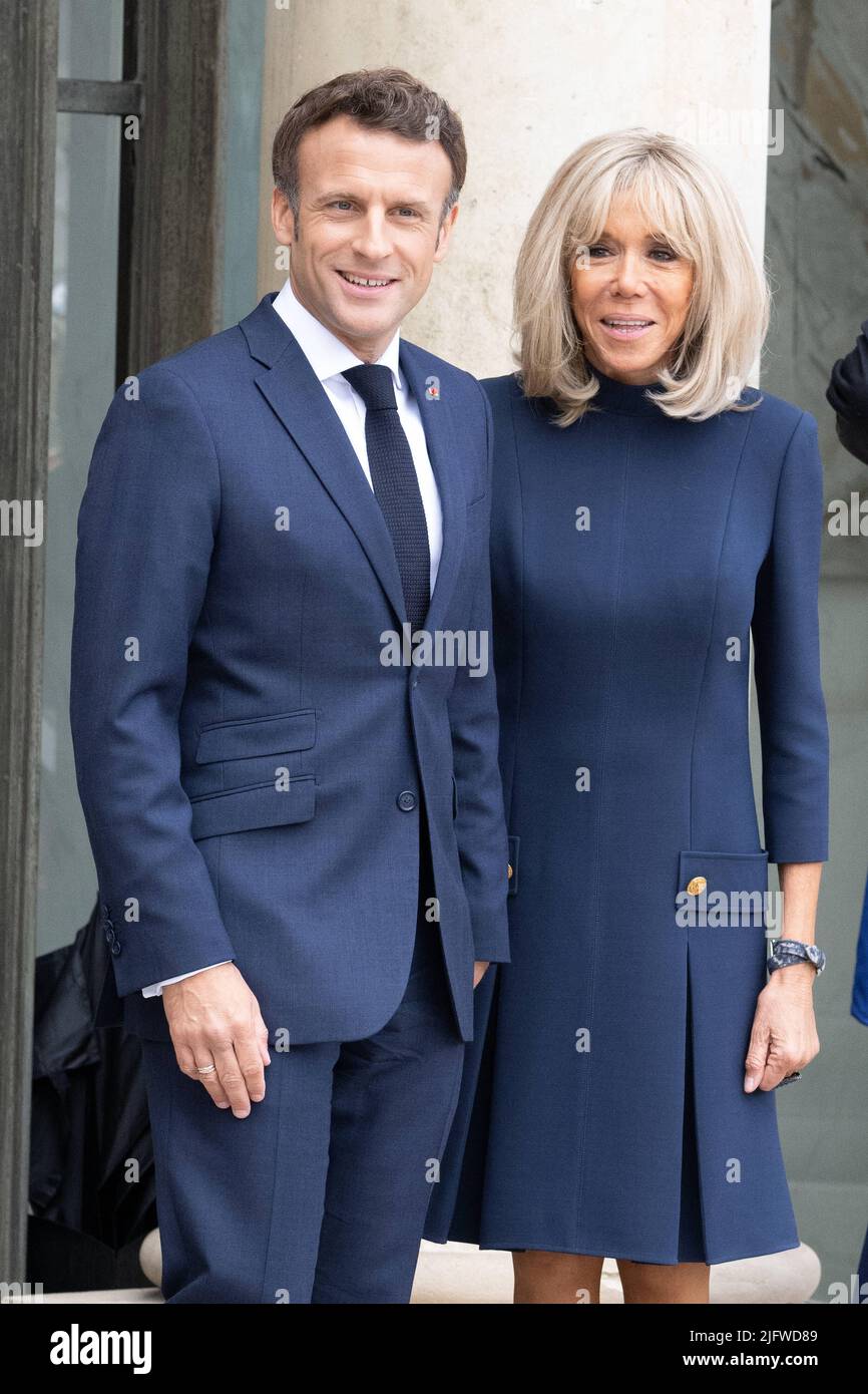 President Emmanuel Macron and his wife Brigitte Macron pose for
