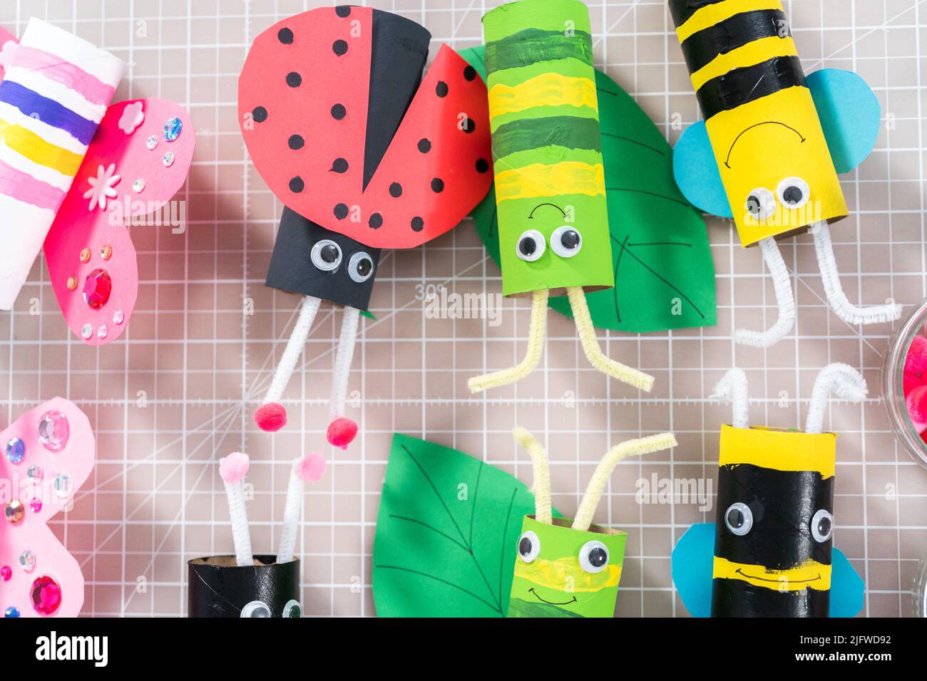 Making different bugs out of empty toilet paper rolls during ...