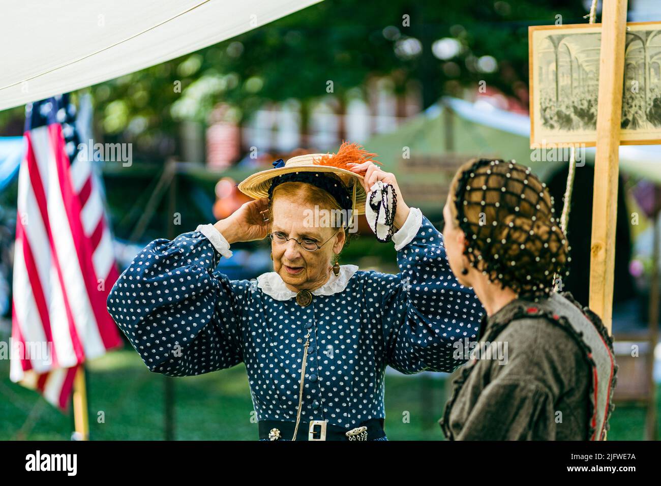 Gettysburg, PA, USA – July 3, 2022: Bringing Civil War-era history to life, a reenactor wearing period clothing greets visitors in the historic town o Stock Photo