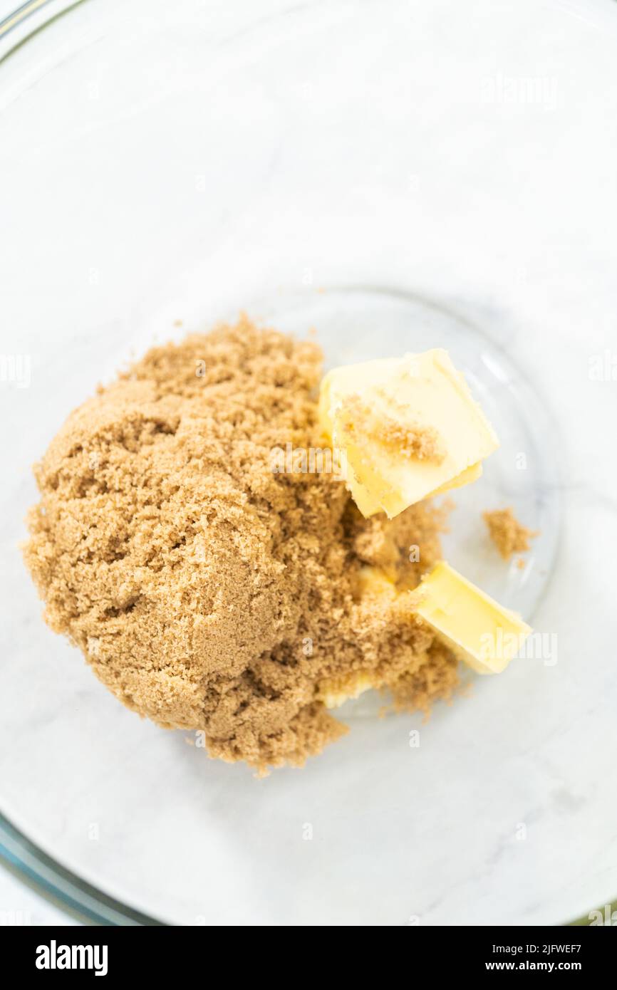 Mixing ingredients in a glass mixing bowl to bake chocolate graham