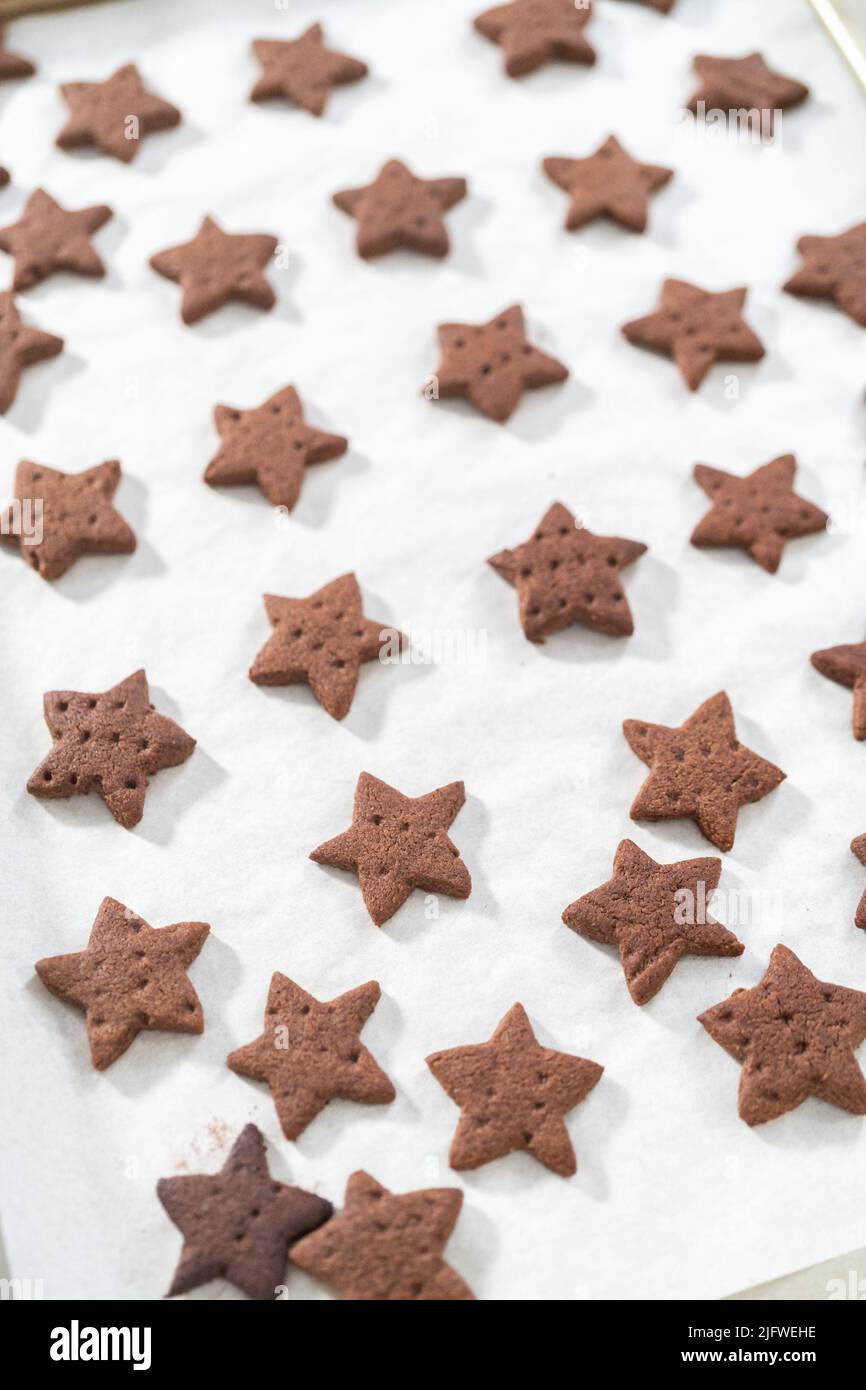 Cooling freshly starshaped baked chocolate graham crackers on the