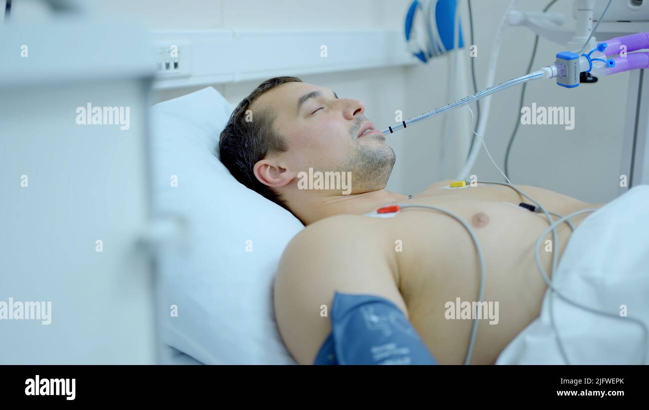 Caucasian man coming out of the coma at the hospital room. Action. Sick ...