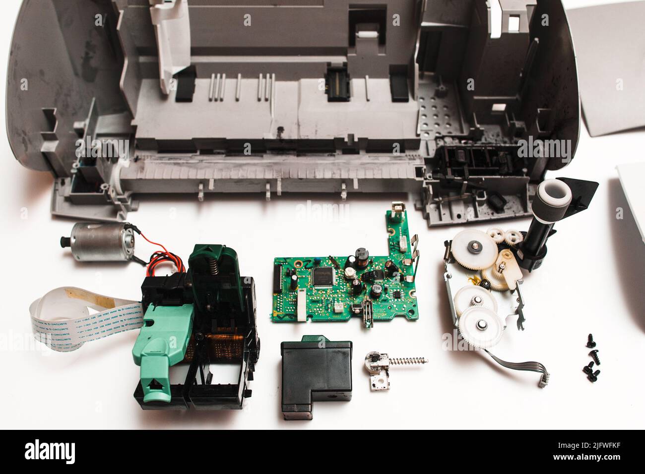 parts of the broken ink jet printer on white background Stock Photo