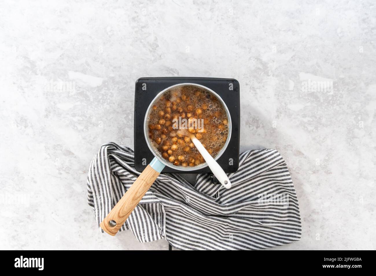 Flat lay. Cooking boba pearls in a cooking pot to prepare mango boba
