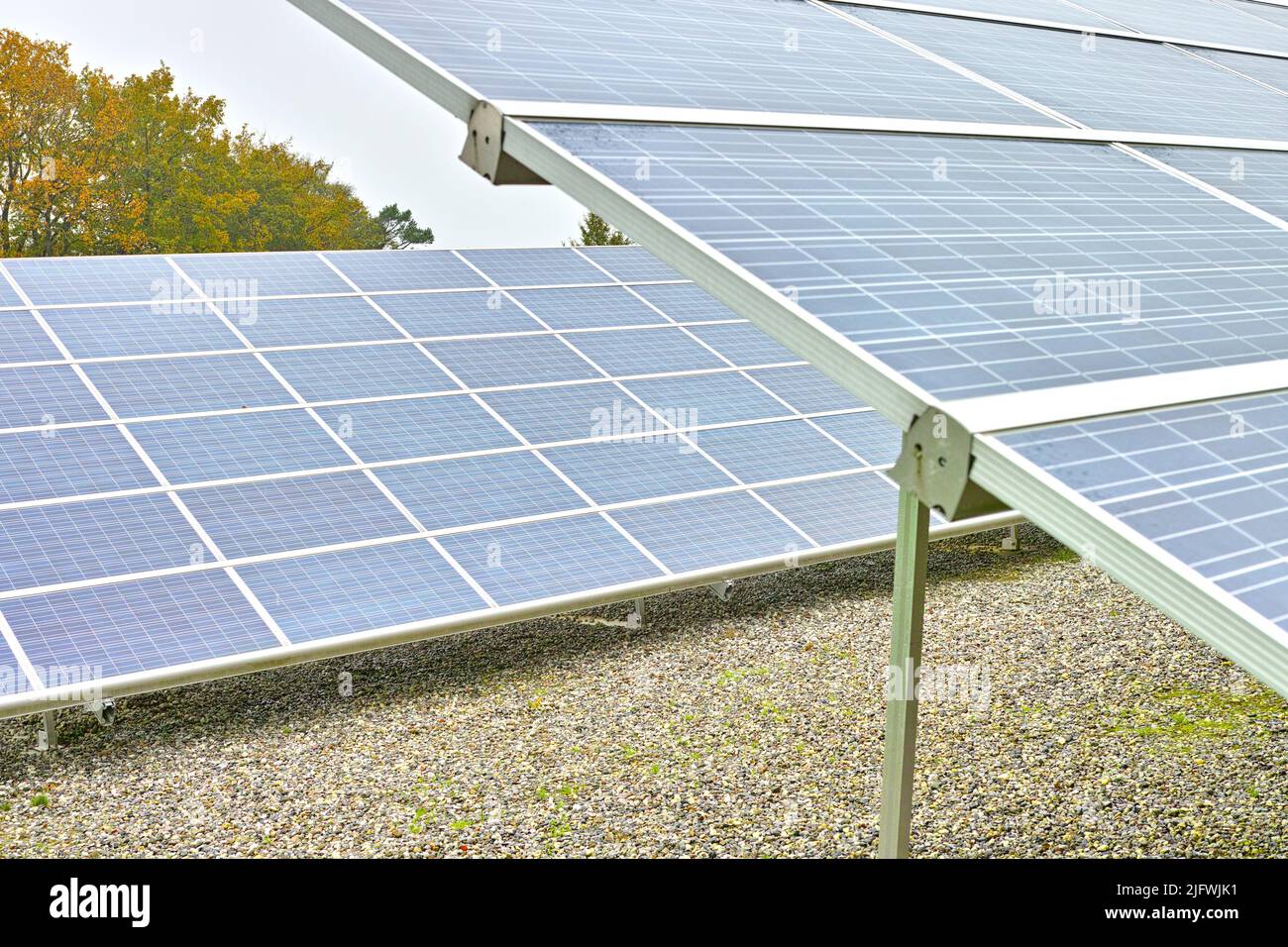 Solar power installation in Denmark. Photovoltaic cell panels as renewable and alternative energy source. Generating electricity in power supply Stock Photo
