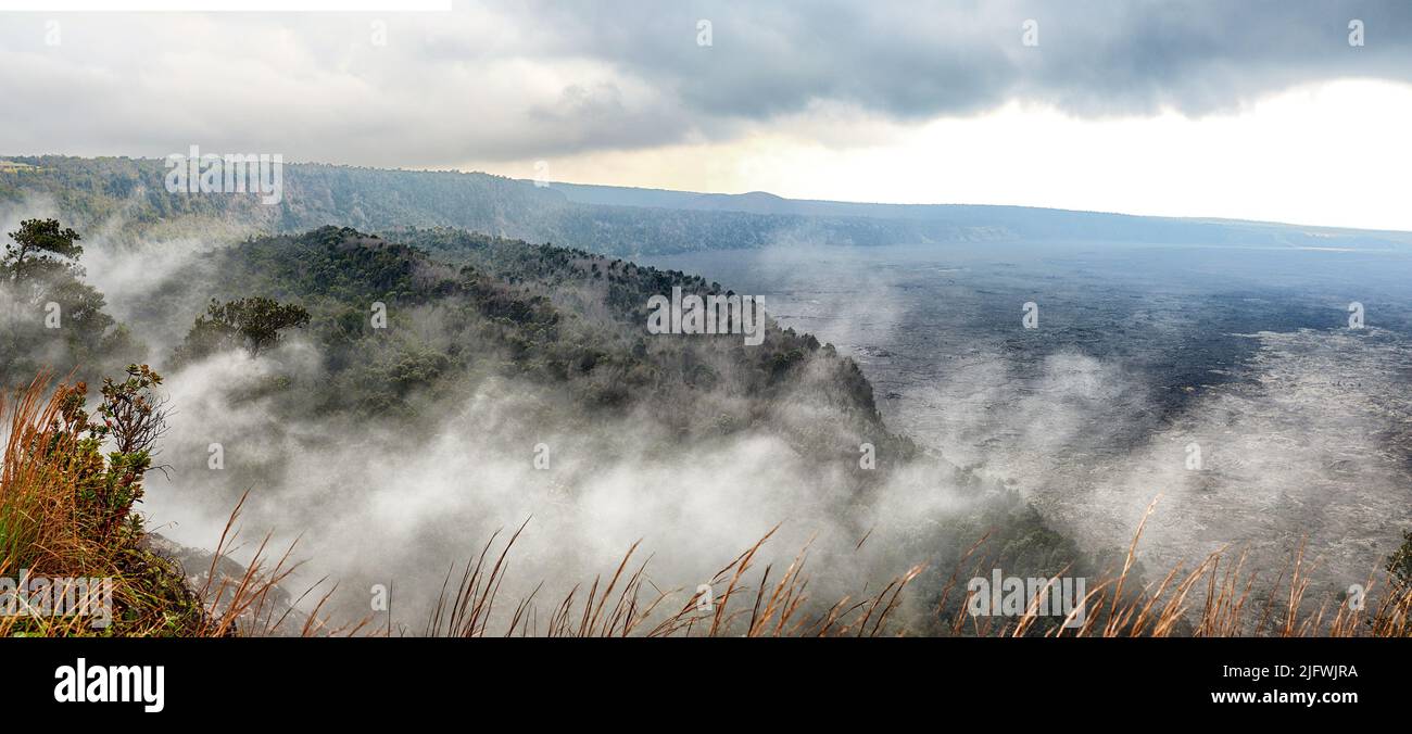 Landscape of misty mountain on Big Island Hawaii. Scenic view of Mauna Kea, dormant volcano in a remote area. Vast foggy expanse of nature and cloudy Stock Photo