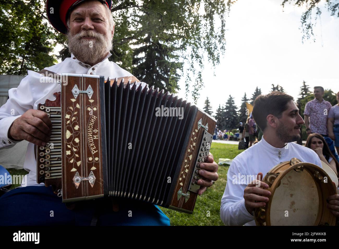 Moscow, Russia. 26th of June, 2022. A cossack plays an accordion at a ...