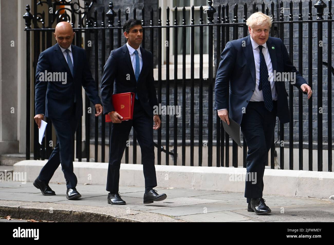File photo dated 07/09/21 of (left to right) Health Secretary Sajid Javid, Chancellor of the Exchequer Rishi Sunak and Prime Minister Boris Johnson arriving at No 9 Downing Street for a media briefing. Chancellor of the Exchequer Rishi Sunak and Health Secretary Sajid Javid, have resigned after the Prime Minister was forced into a humiliating apology over his handling of the Chris Pincher row after it emerged he had forgotten about being told of previous allegations of 'inappropriate' conduct. Issue date: Tuesday July 5, 2022. Stock Photo