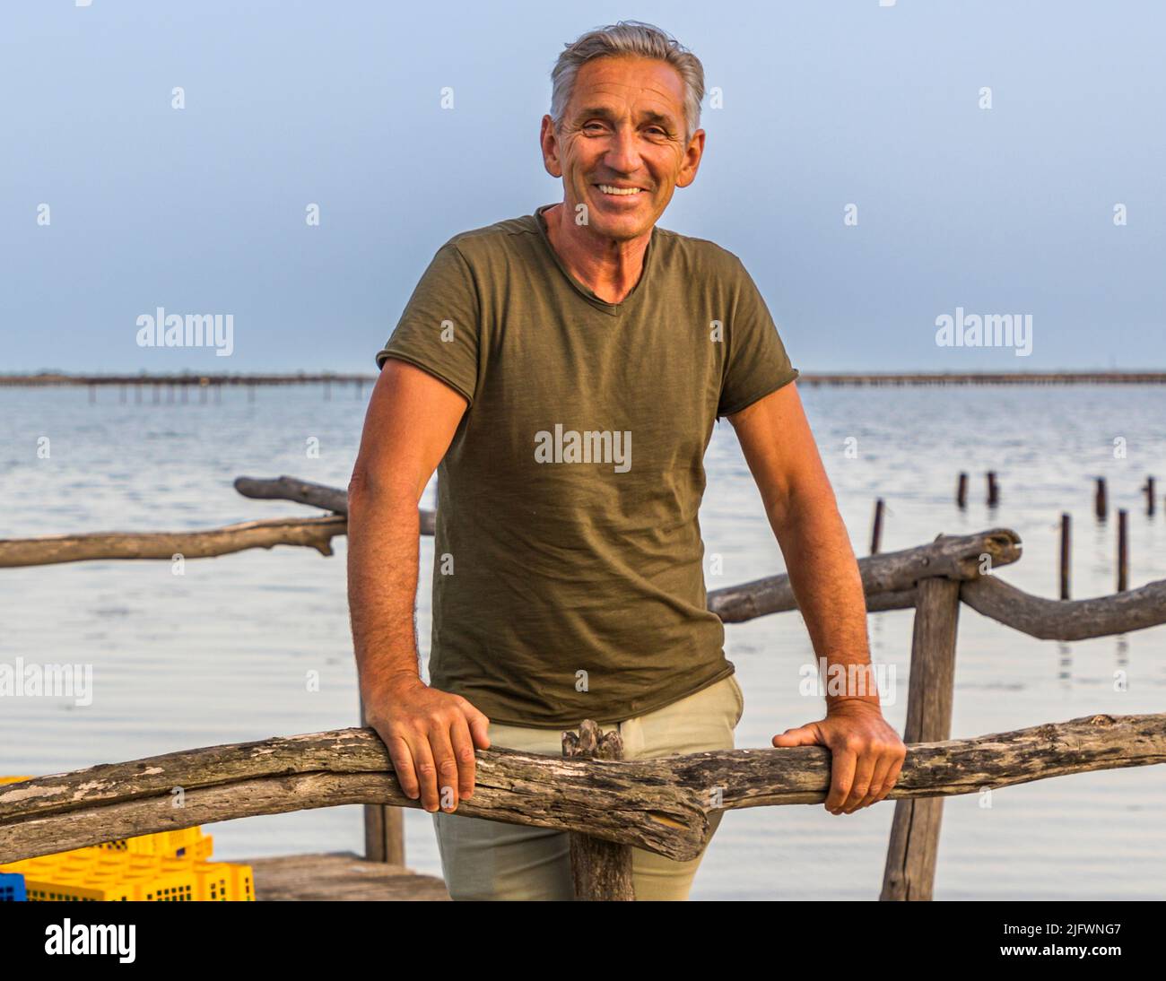 Florent Tarbouriech (on the jetty at Le St Barth) has revolutionized oyster farming in the Mediterranean Sea Stock Photo