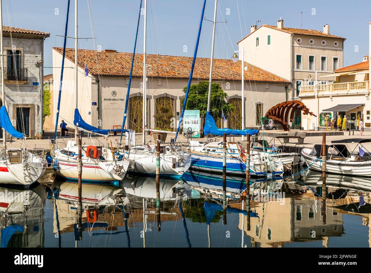 The parent company of Noilly Prat in Marseillan (France) in the Languedoc. Directly on the tranquil harbor of the small town about 50 km from Montpellier, vermouth has been produced since 1859 to this day Stock Photo