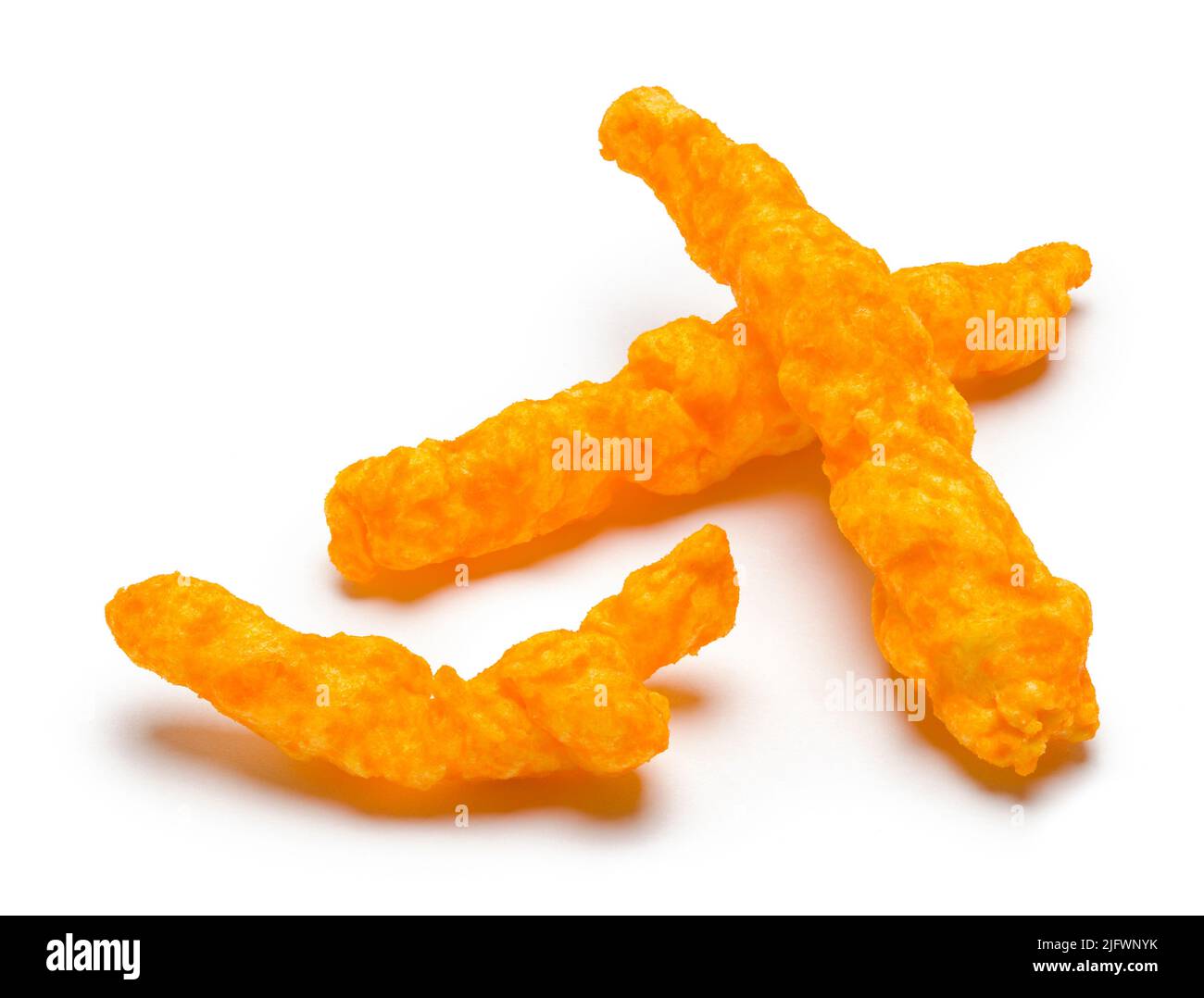 Three Crunchy Cheese Puffs Cut Out on White. Stock Photo