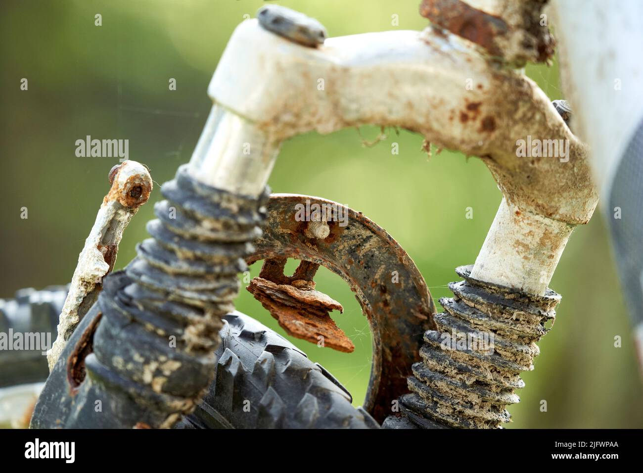 Close up of an old rusty bicycle. Brakes and tires are defective