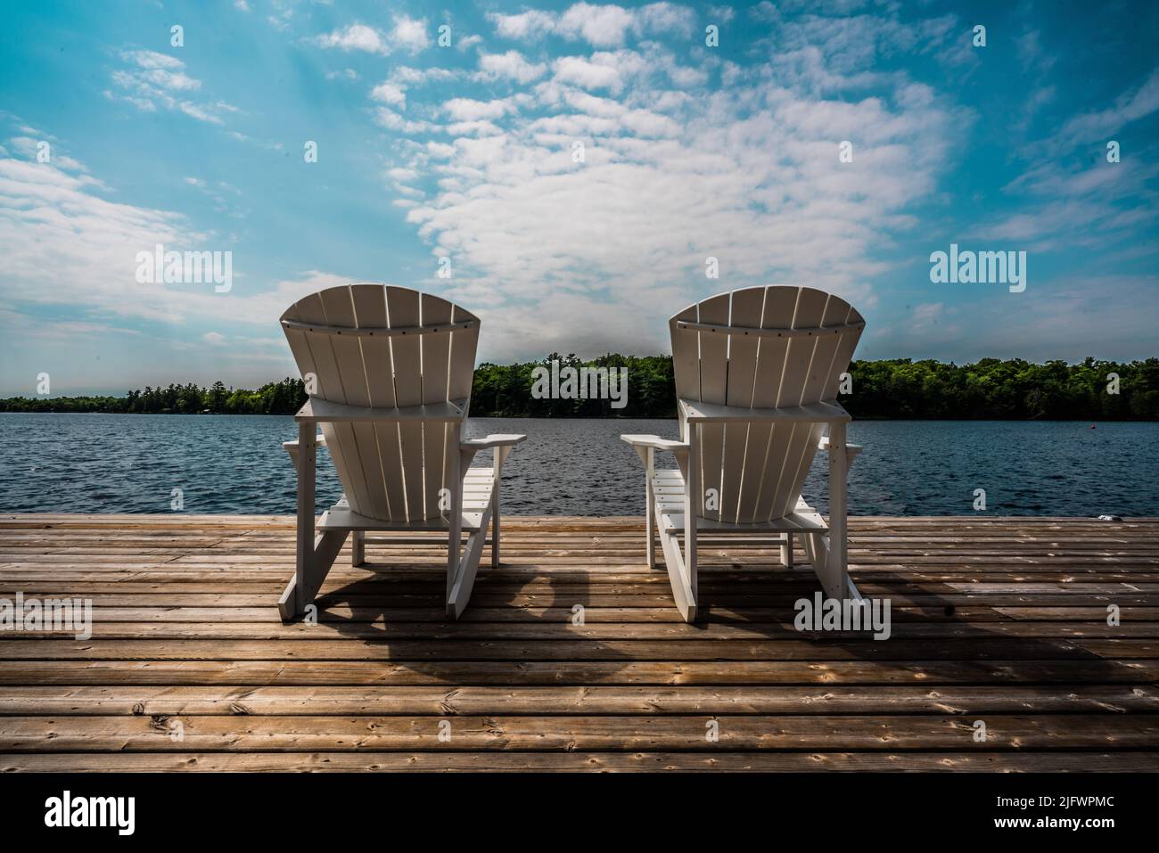 Two wooden chairs facing hi-res stock photography and images - Alamy