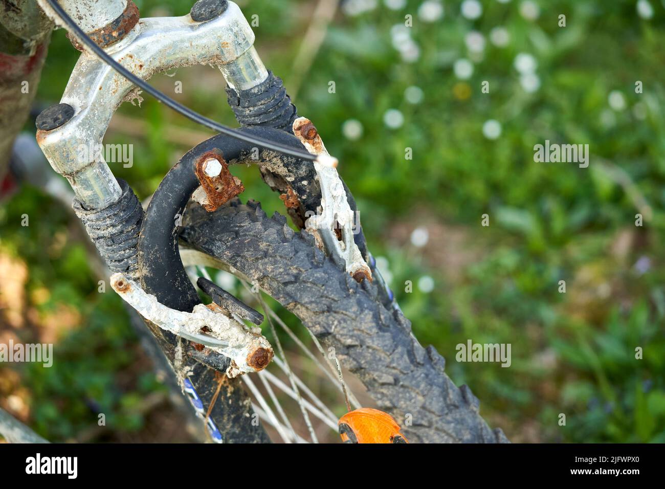 Close up of an old rusty bicycle. Brakes and tires are defective. MTB Two-wheeler is a sea find (Seefunde). Stock Photo