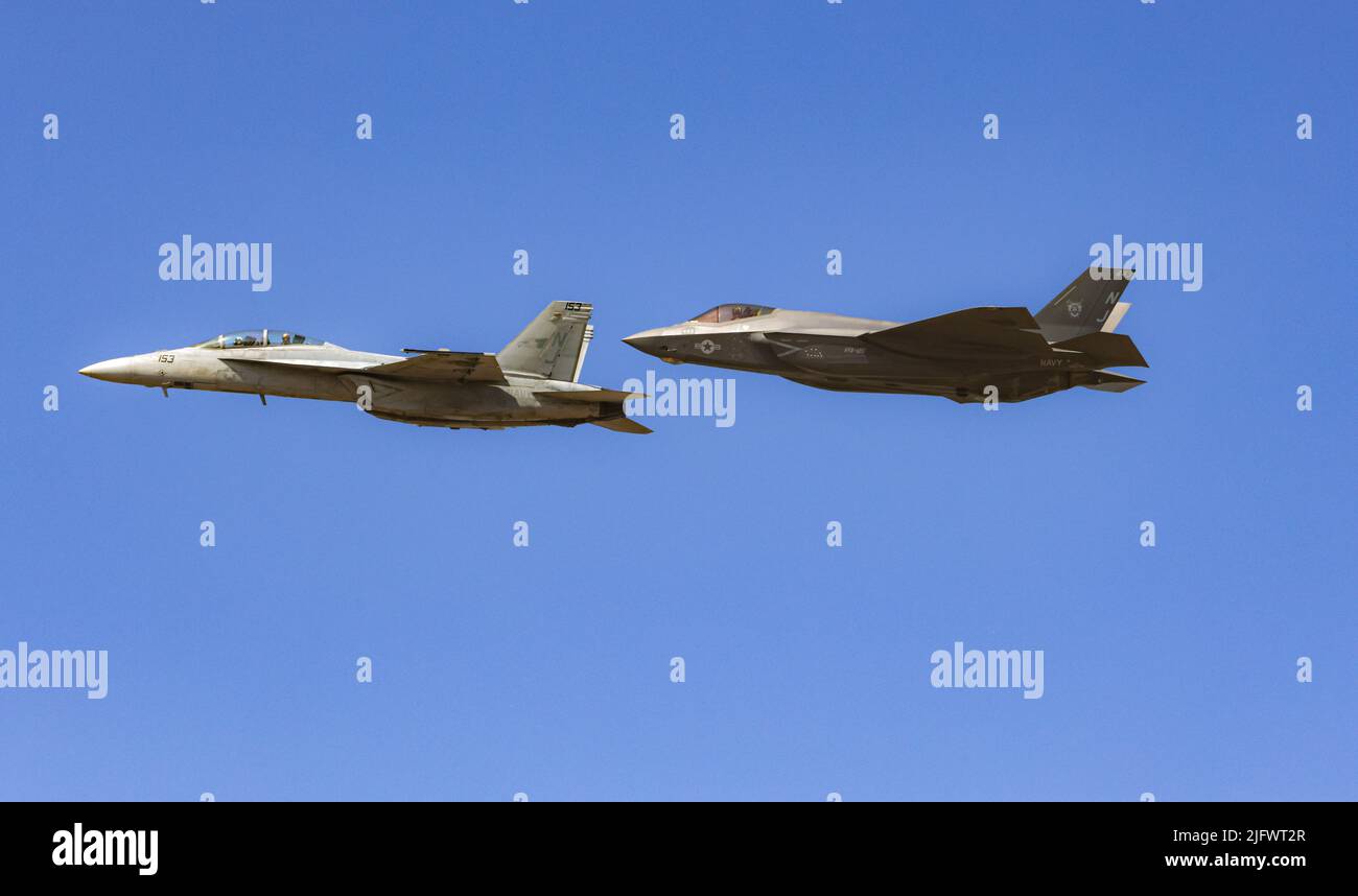 A Lockheed Martin F35 Lightning II And A McDonnell Douglas FA18 Hornet a-lockheed-martin-f35-lightning-ii-and-a-mcdonnell-douglas-fa18-hornet