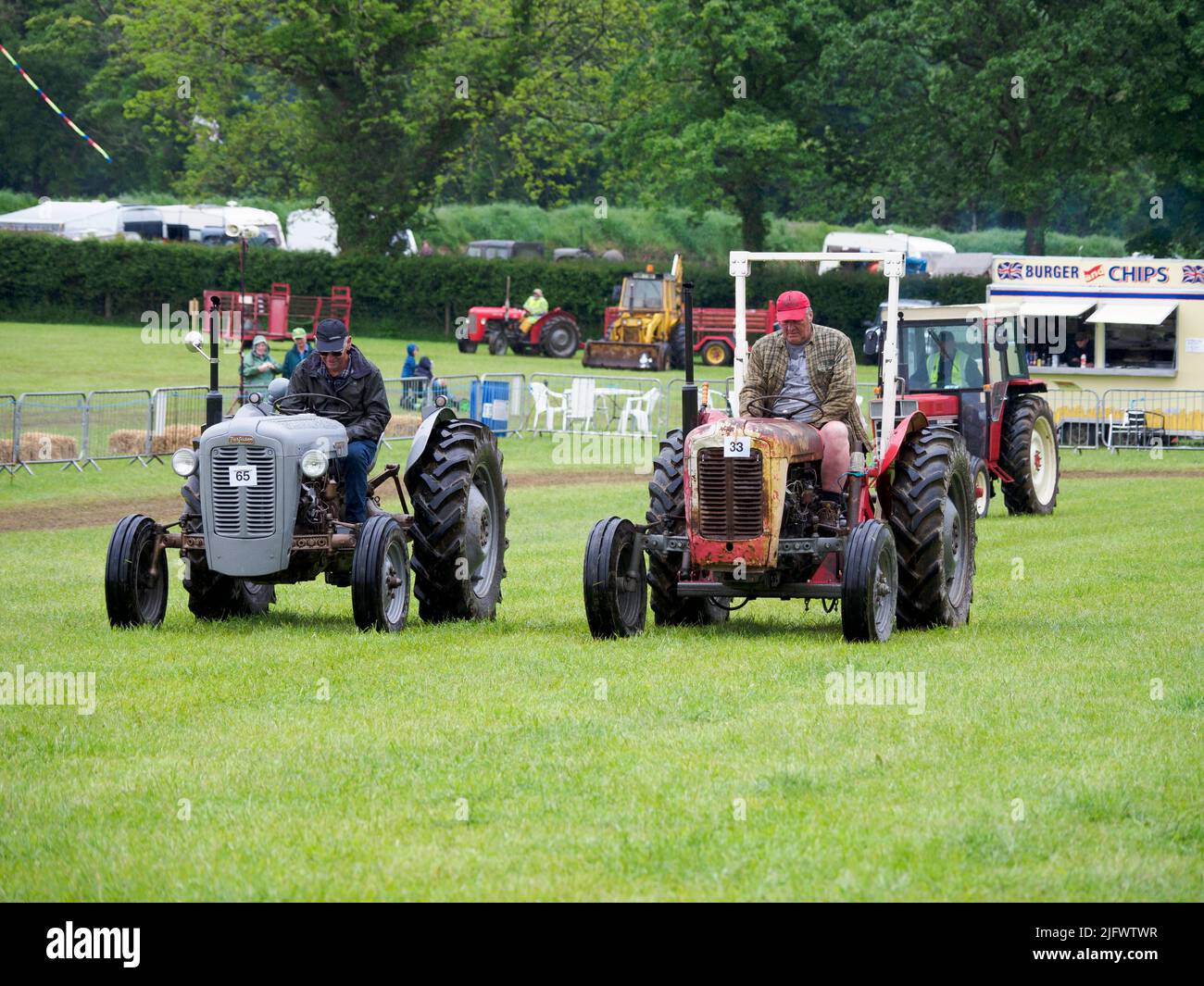 Slow tractor race the winner is the last to cross the line at the Launceston Steam & Vintage Rally, Cornwall, UK Stock Photo
