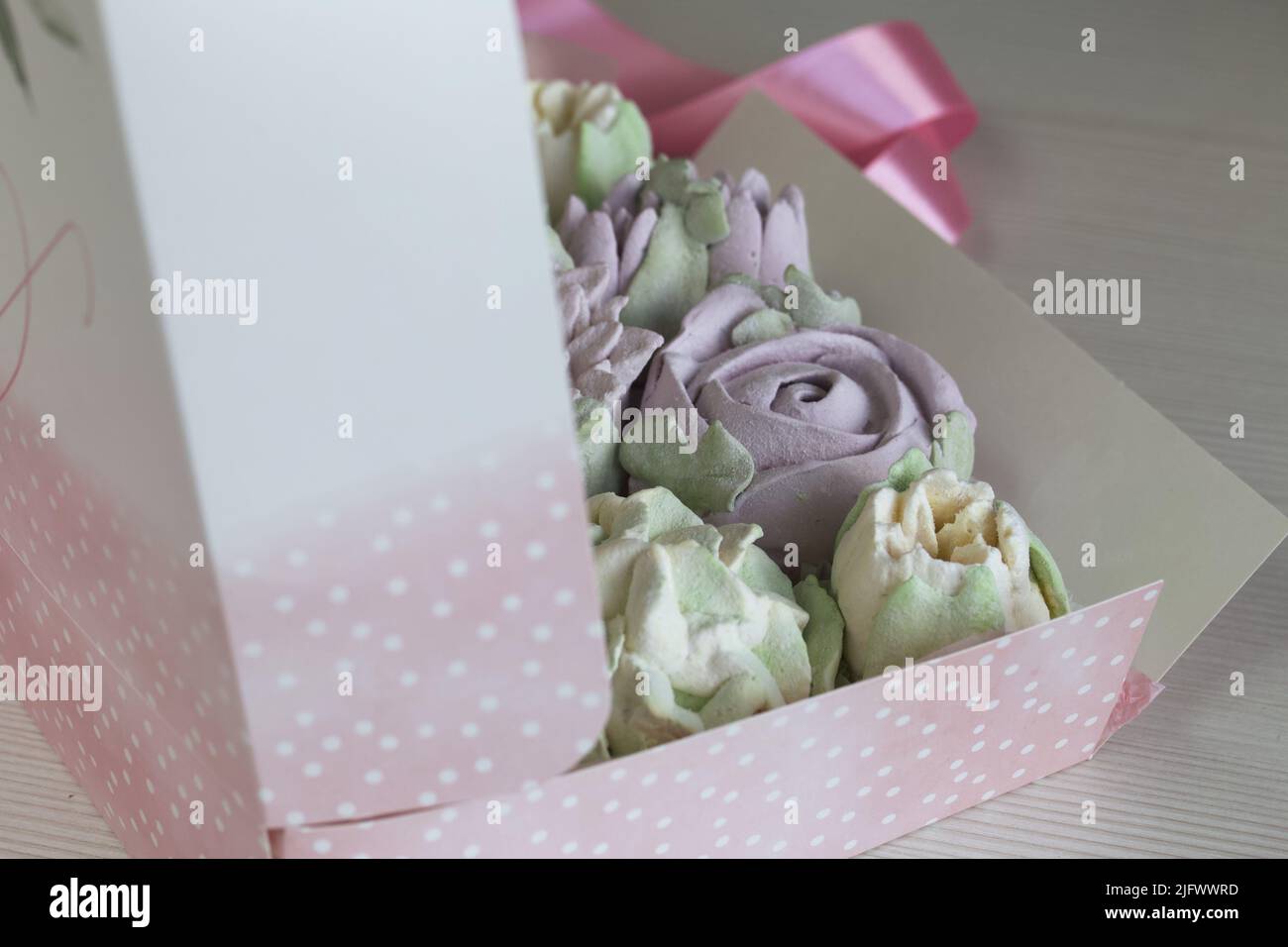 Homemade marshmallows packed in a gift box. Zephyr made in the form of